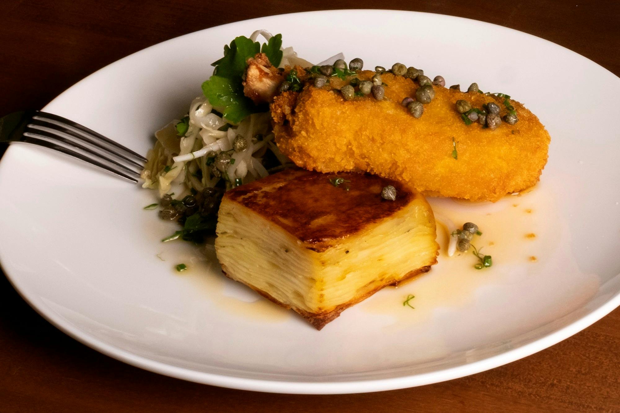 Barongarook Pork Cotoletta, Italian Slaw, Pressed Rosemary Potatoes, Lemon and Caper Beurre Noisette