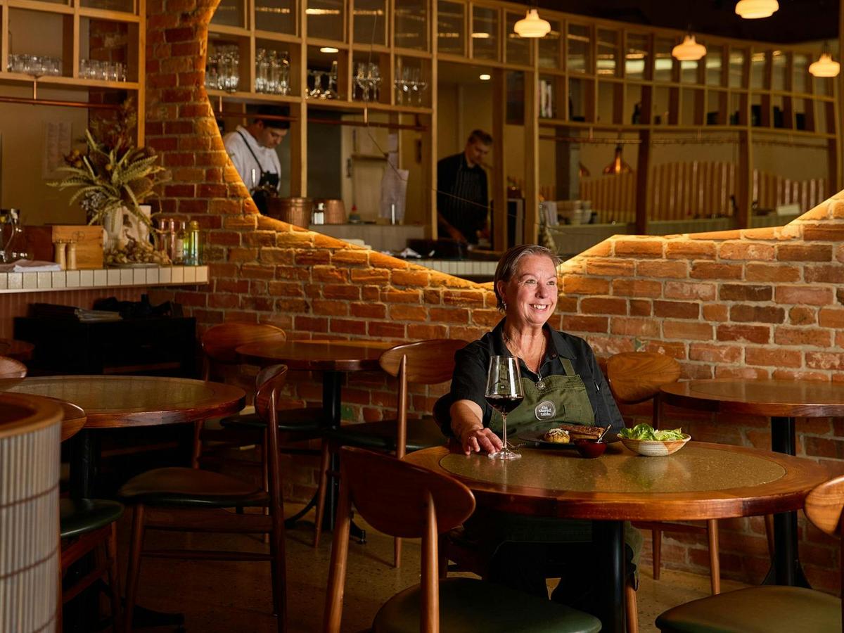 Dianne sitting at table