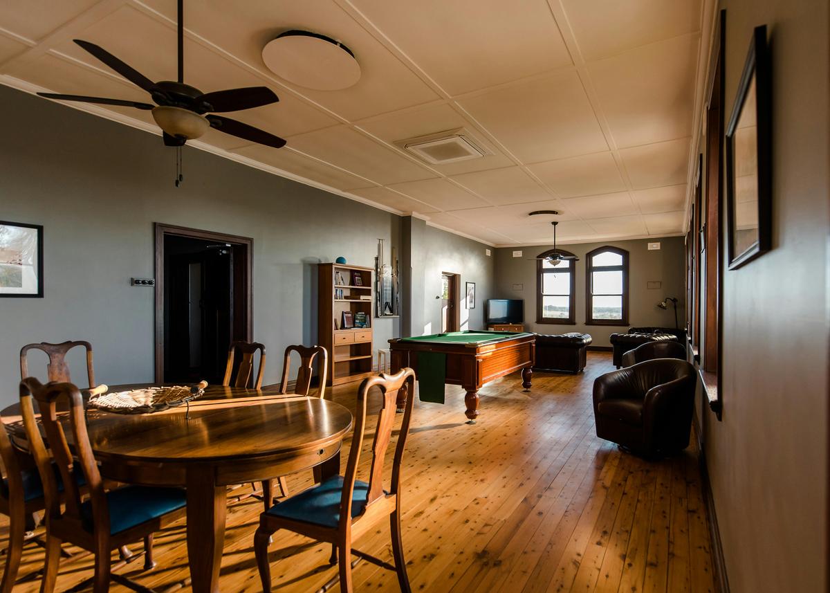 Relax in the upstairs lounge room with a game of pool