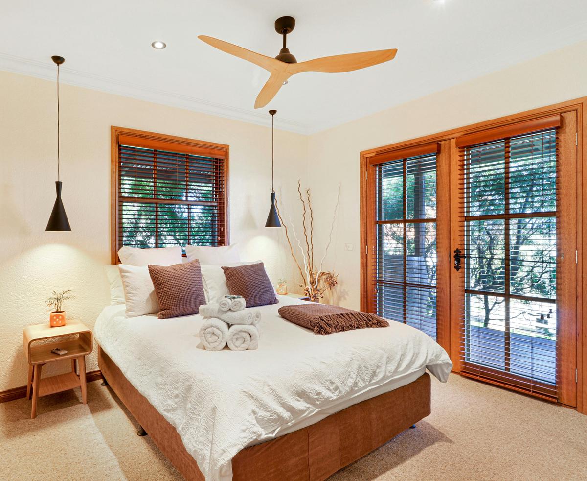 Master Queen bedroom with full-length patio doors