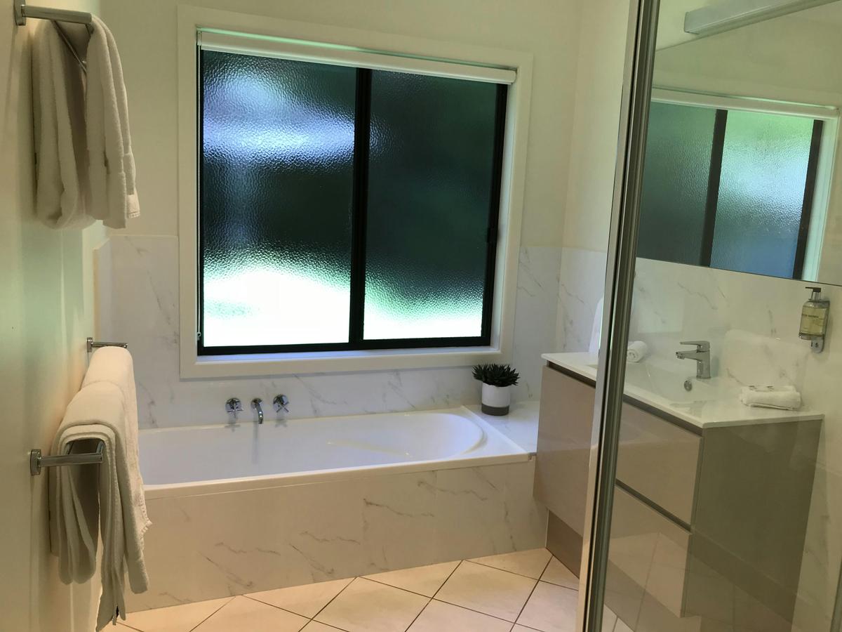 Bathroom with tub and separate shower