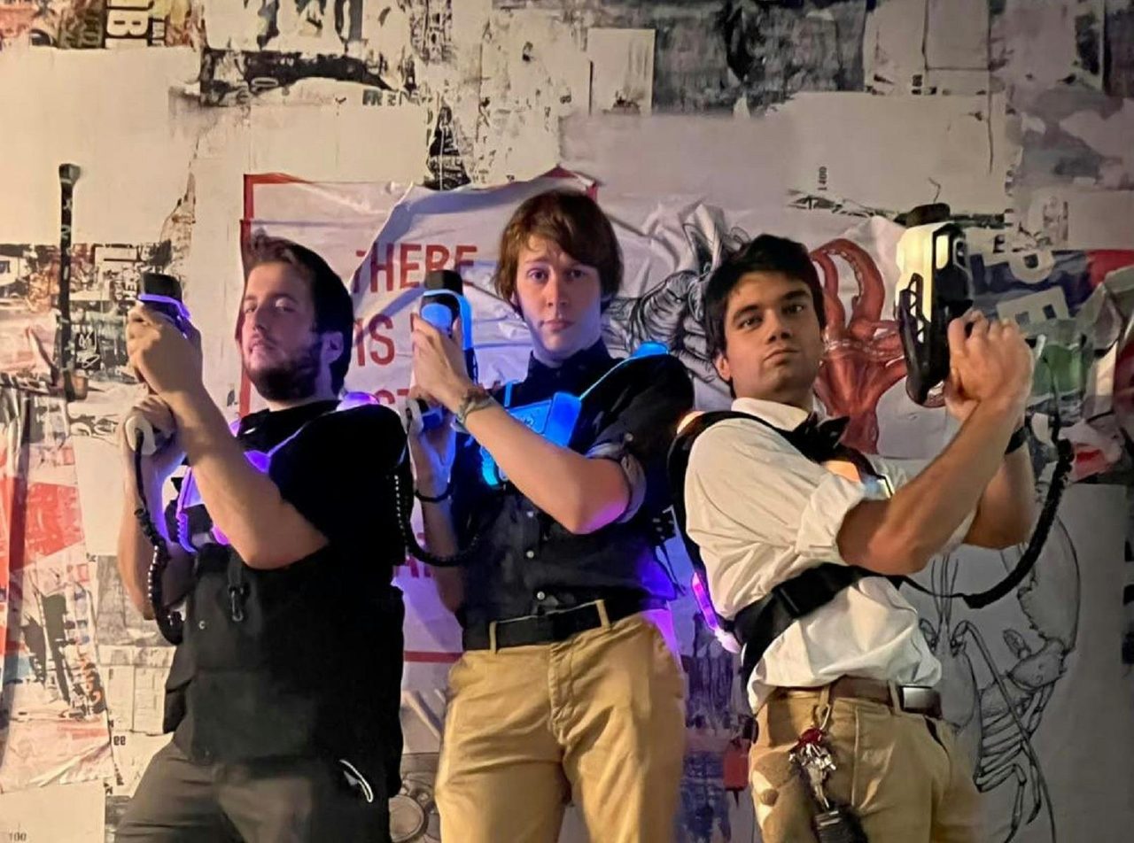 Three men ready for laser tag