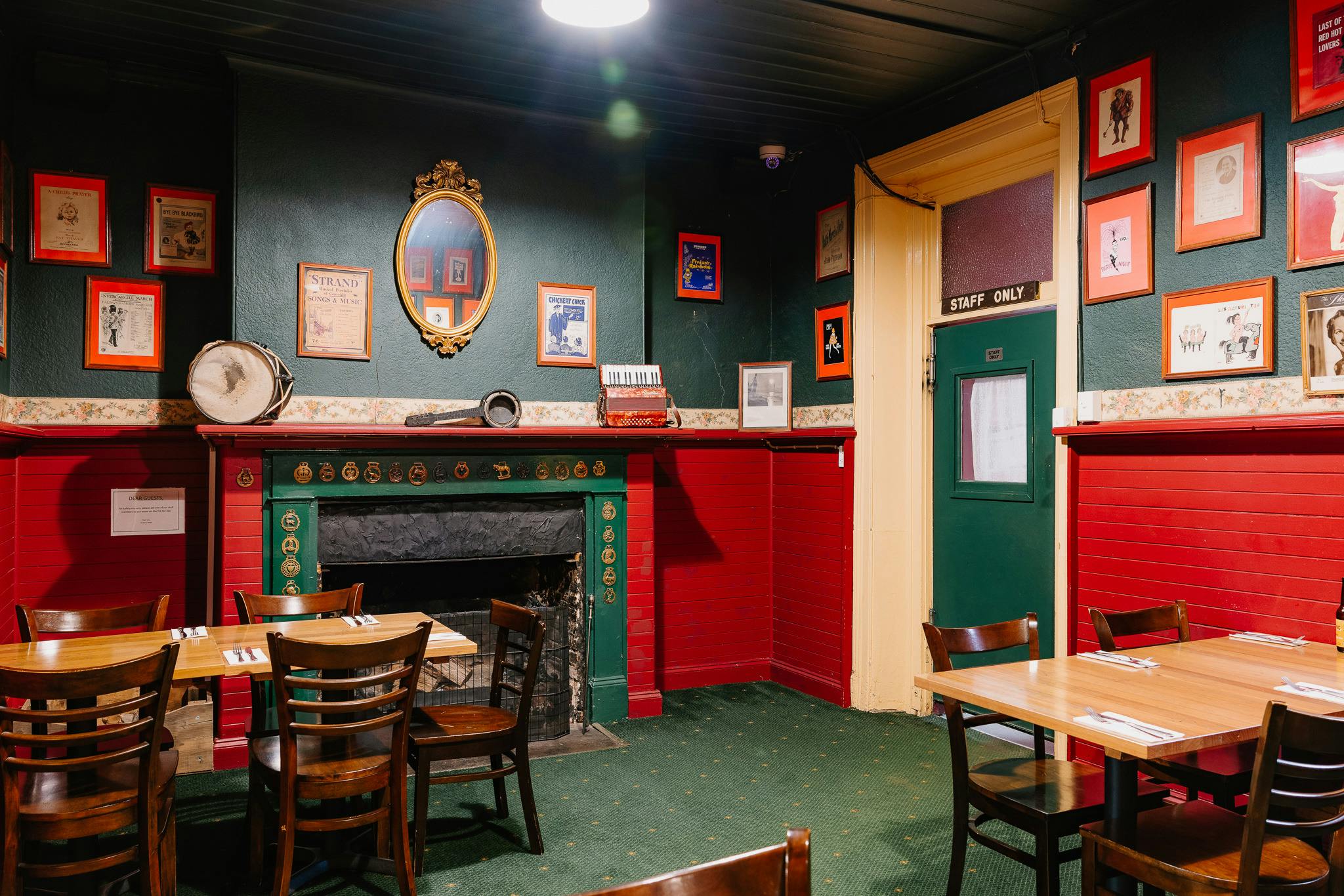 dining room with chairs and tables and pictures on the wall