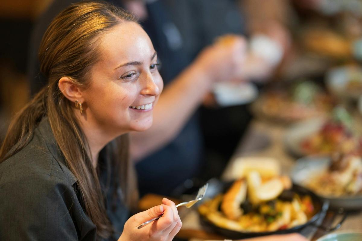 Customers enjoy a meal