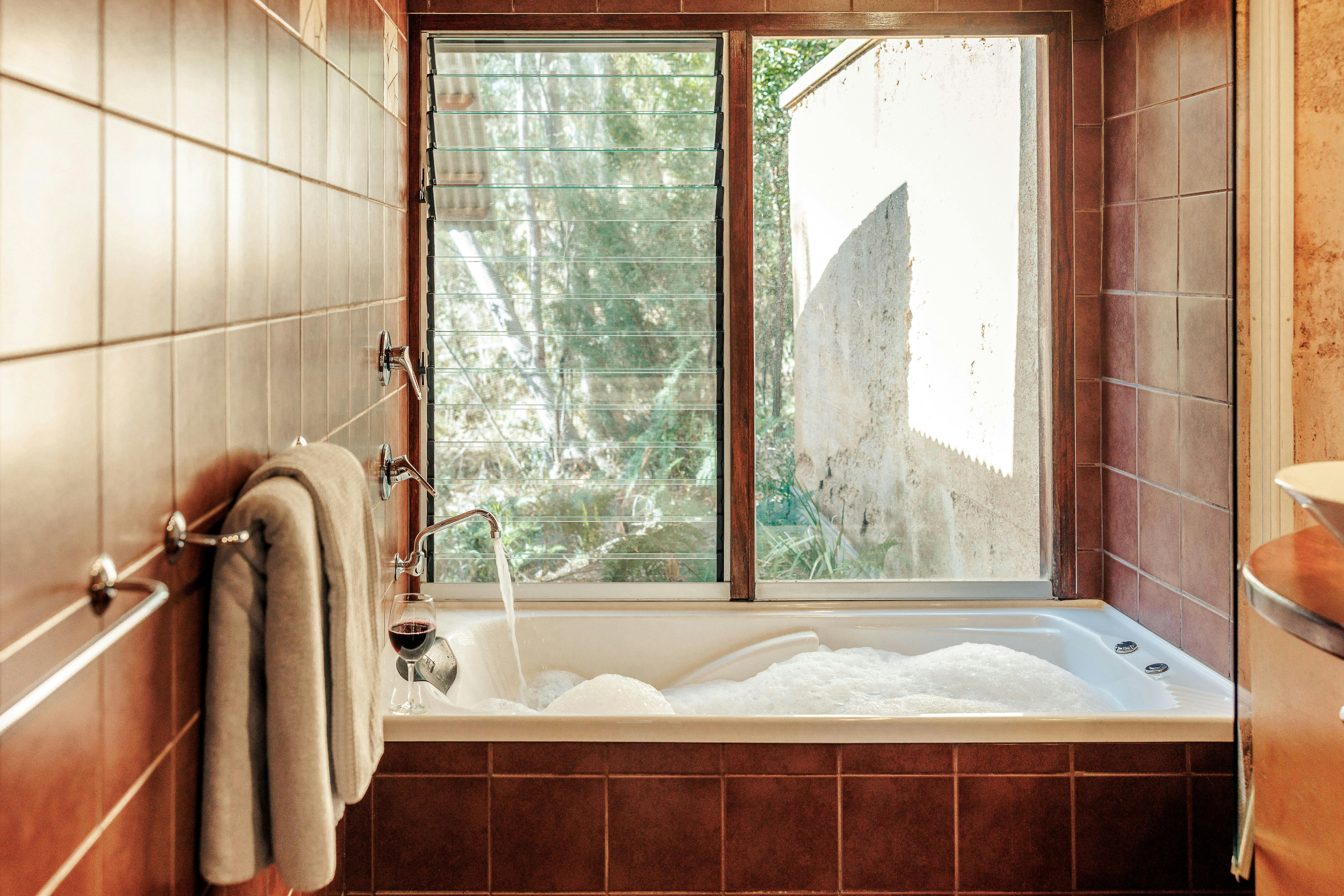 Spa overlooking surrounding bush