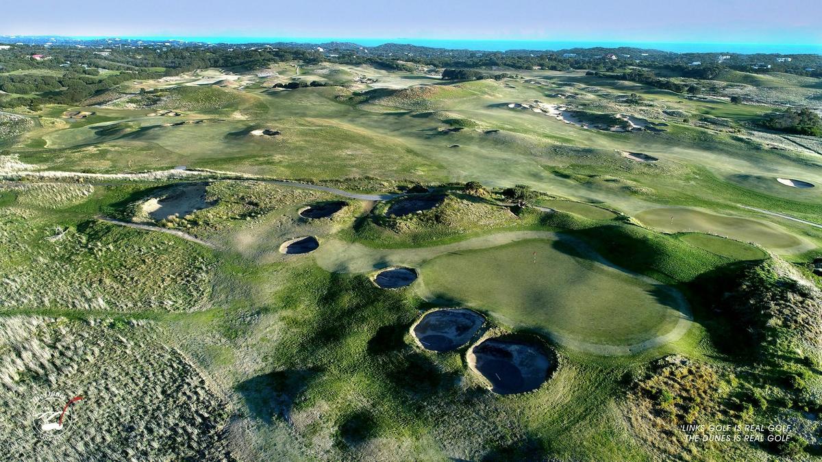 the dunes golf course from above with the ocean in the background