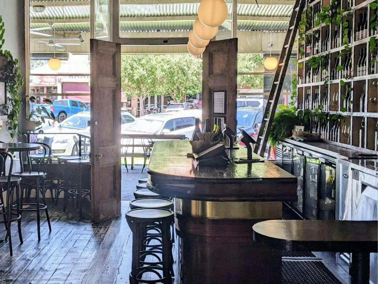 Step inside The Social—where old-world charm meets modern elegance.  Pull up a stool, pour a glass.