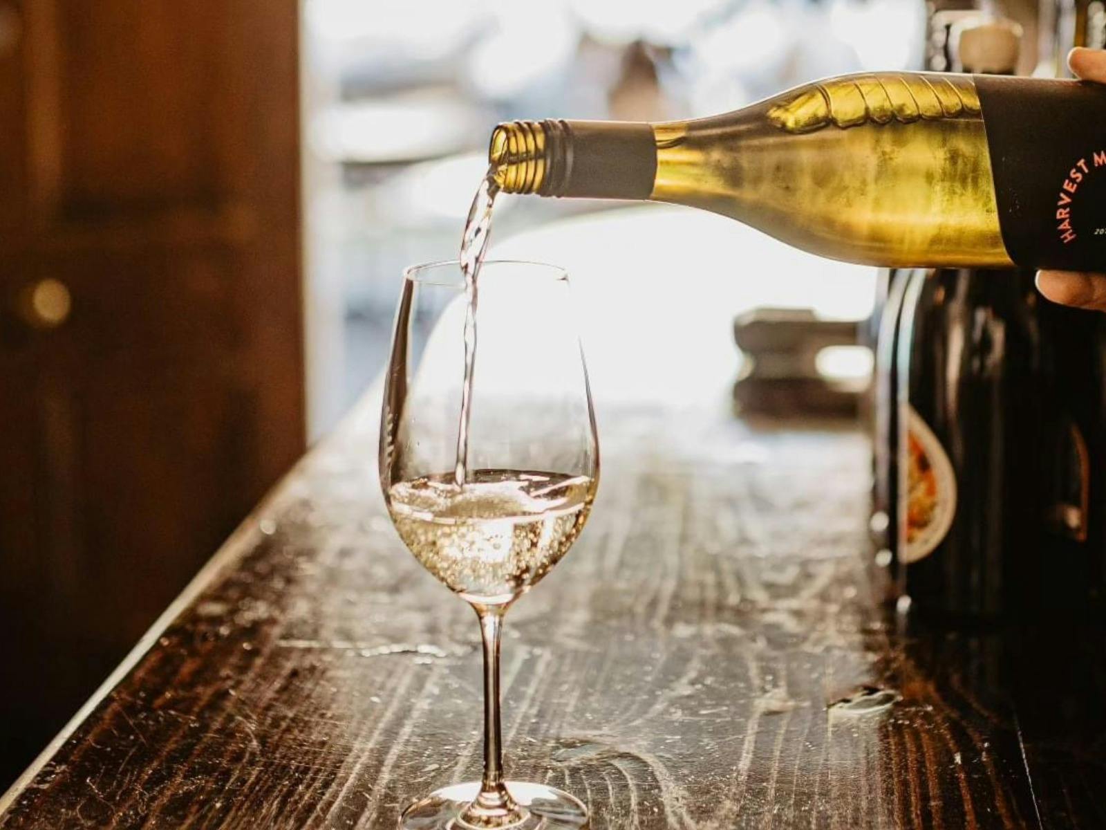 Step inside The Social—where old-world charm meets modern elegance.  Pull up a stool, pour a glass.