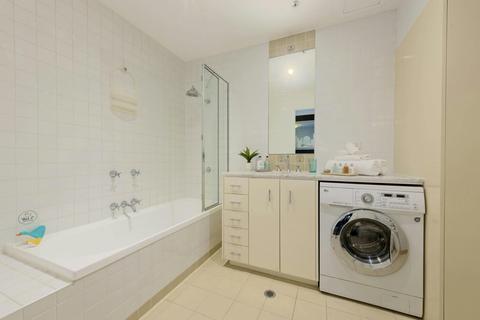 Bathroom with washer and dryer