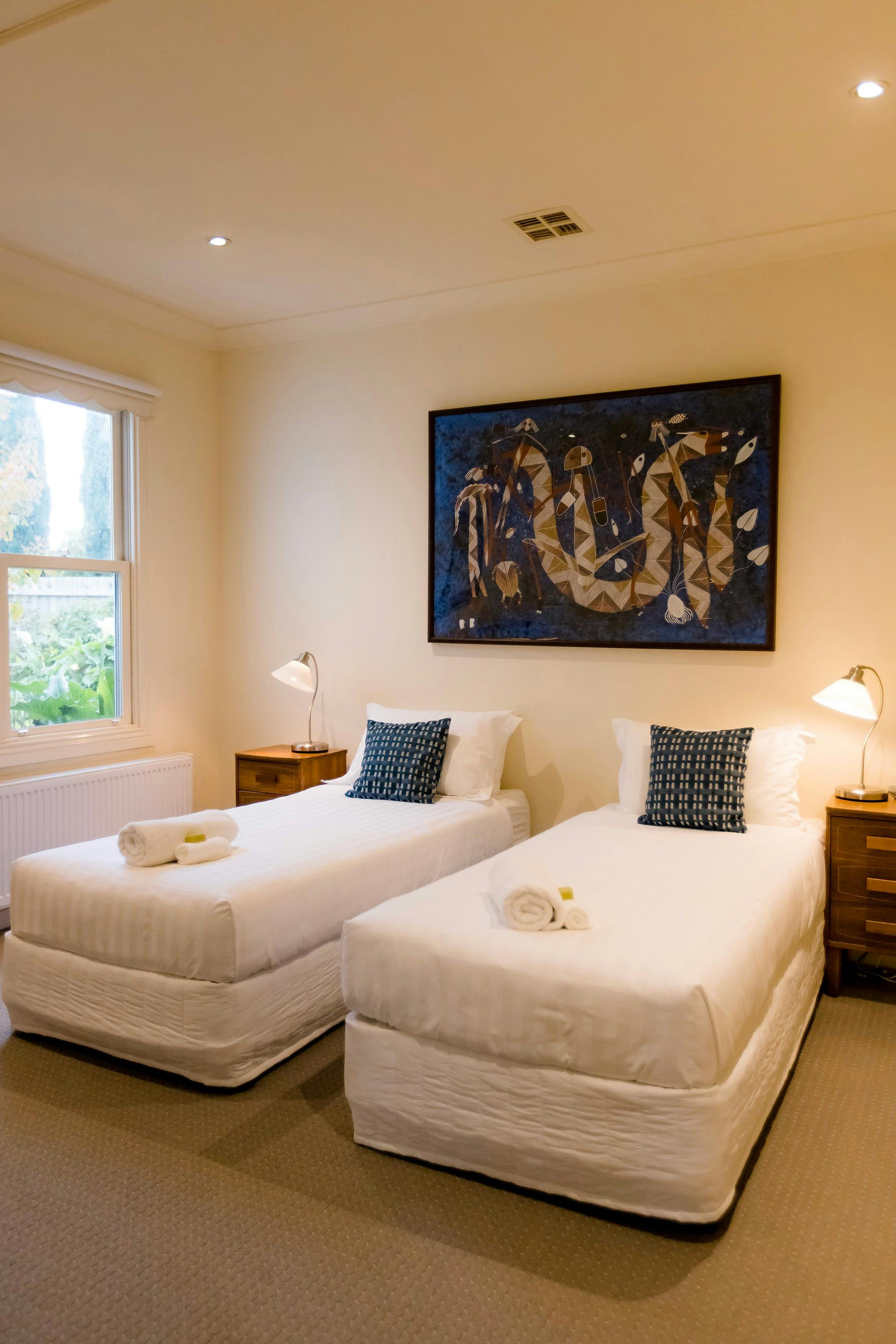 Light filled Accessible bedroom with tranquil garden outlook.