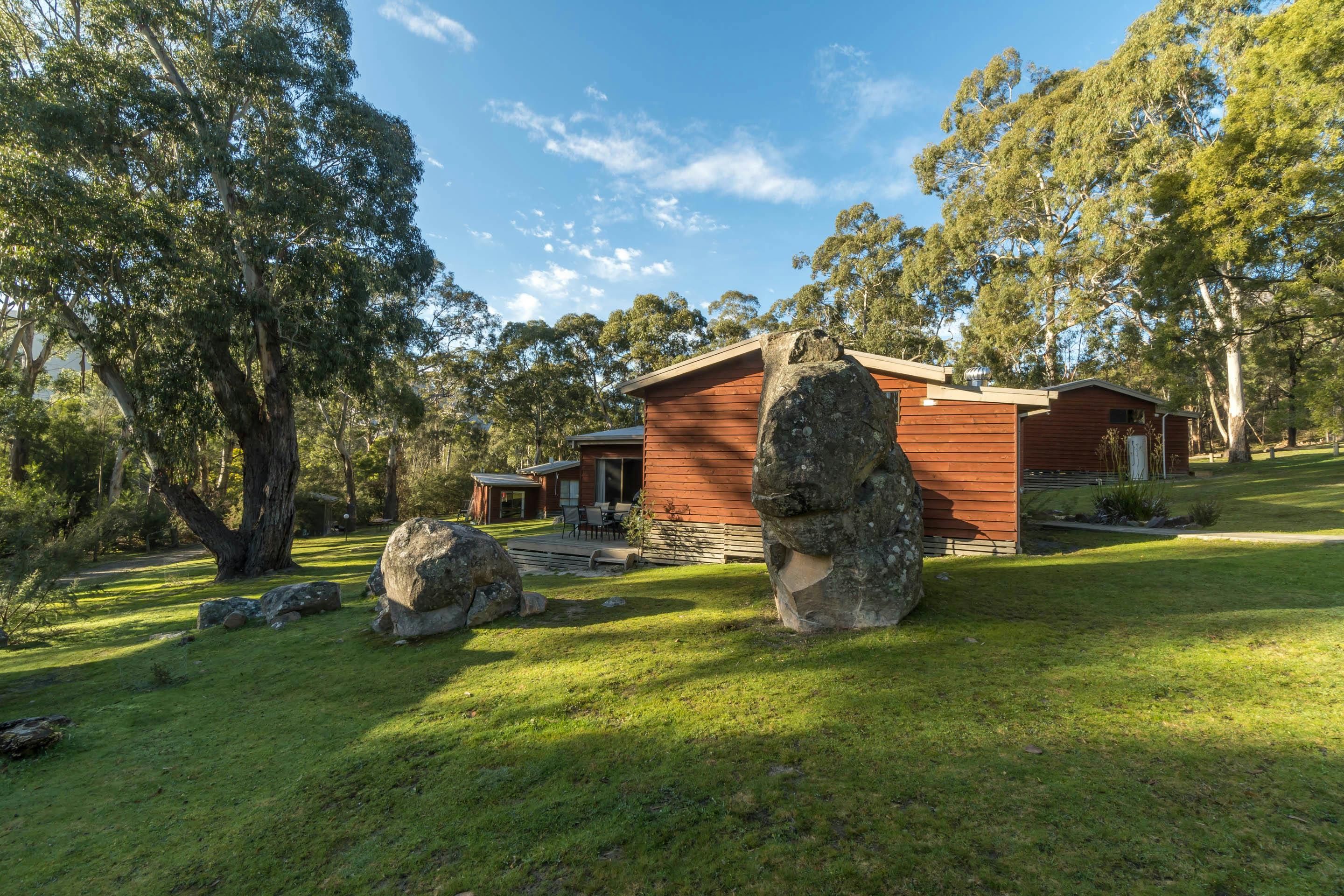 Cottages among boulders and trees