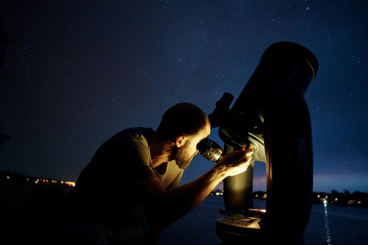 Look through a high powered telescope to see the stars up close