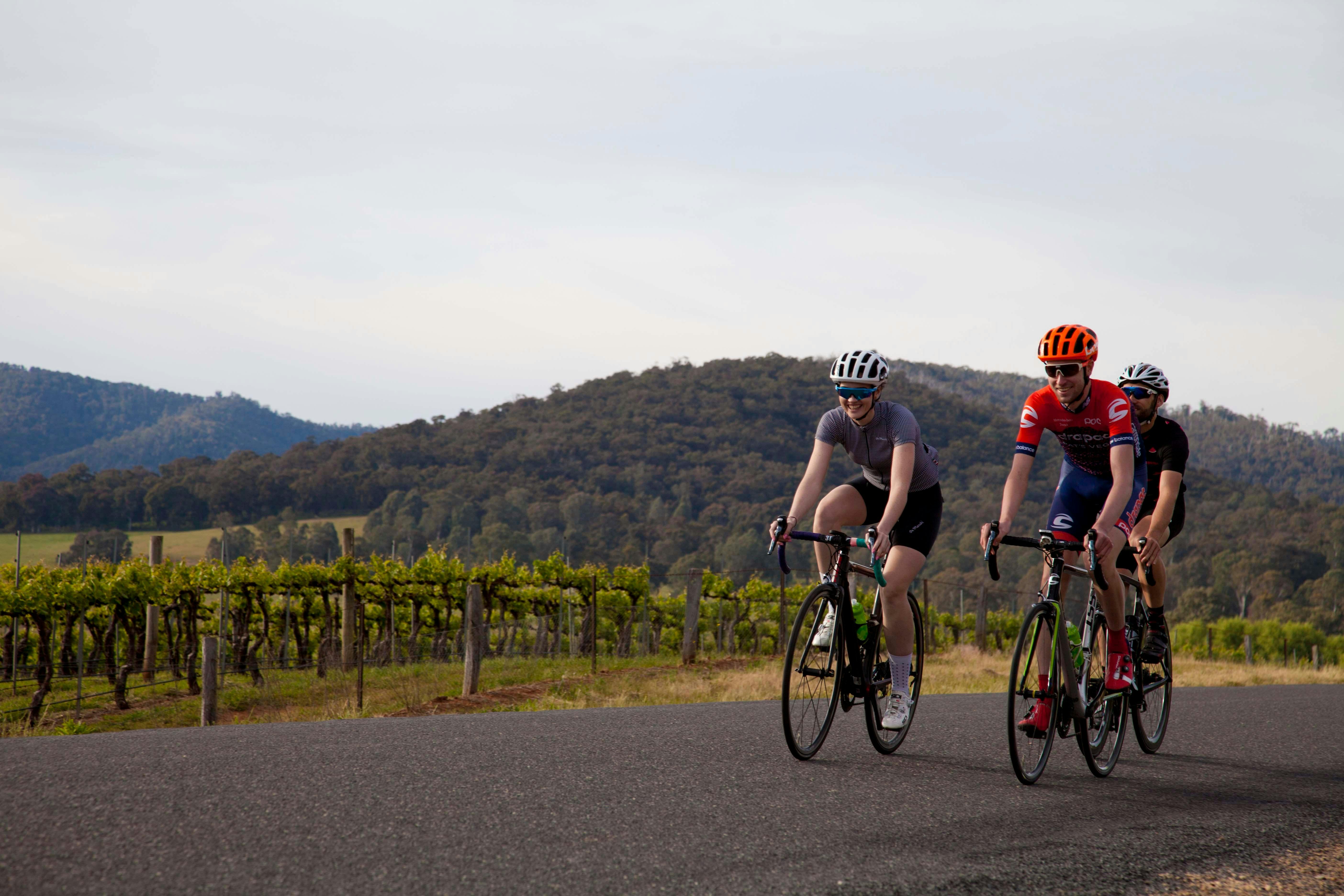 Cyclists riding on Road towards Lake William Hovell in the King Valley