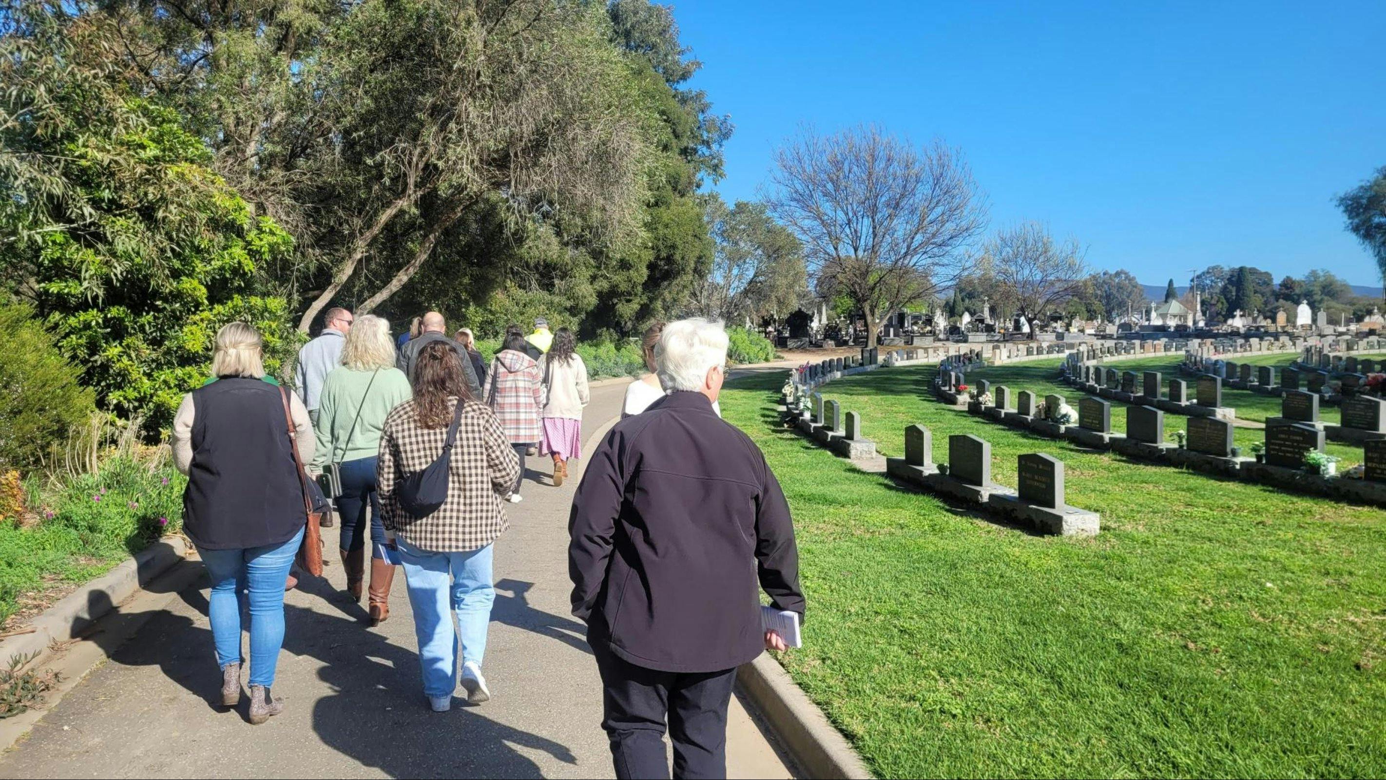 Group walking through Cemetery