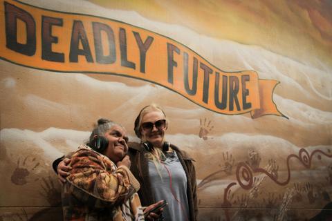 Aunty Rieo Ellis and Charley Woolmore listening to the Yalinguth app at the old Health Service