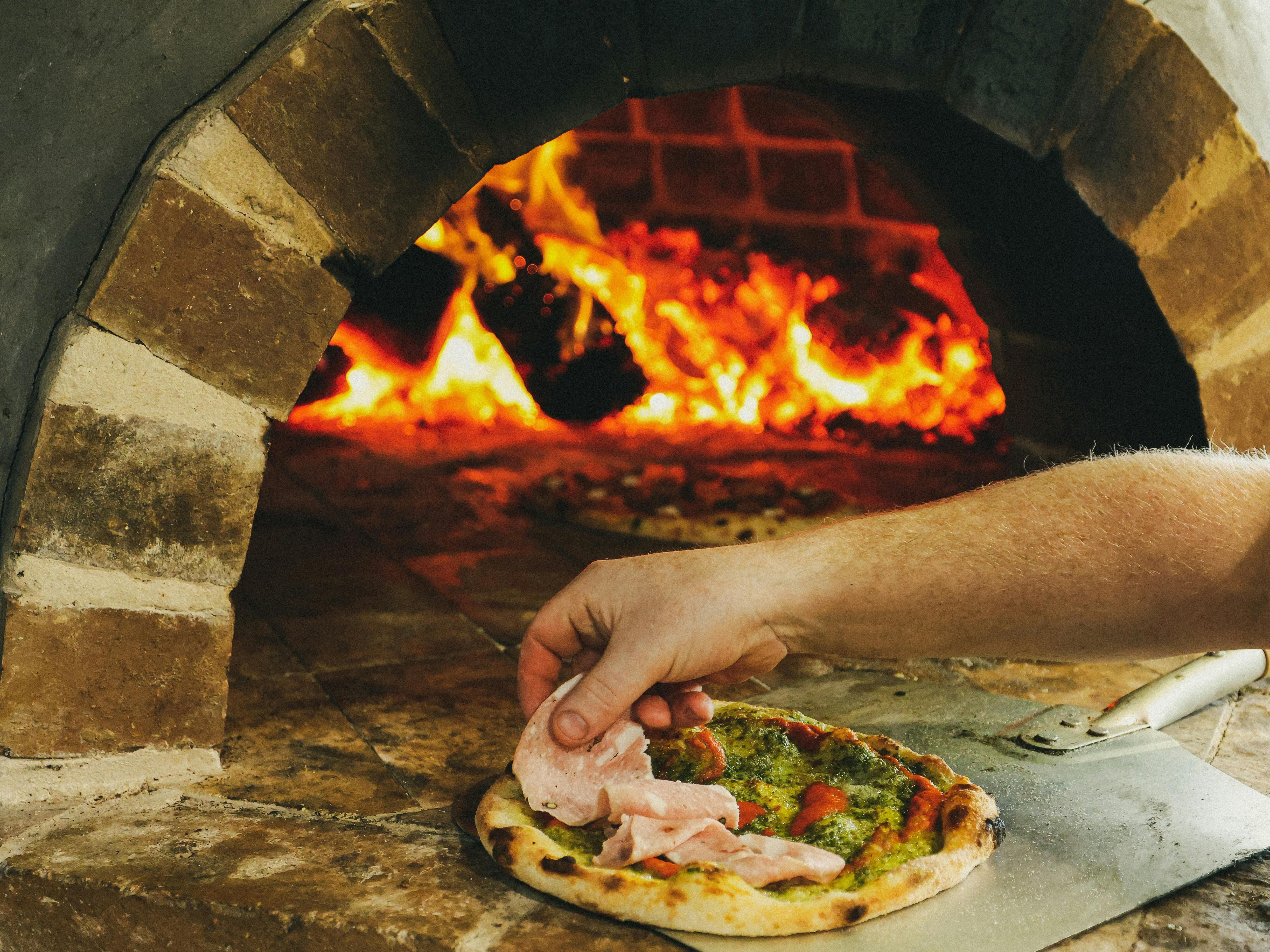 Pizza cooking in oven