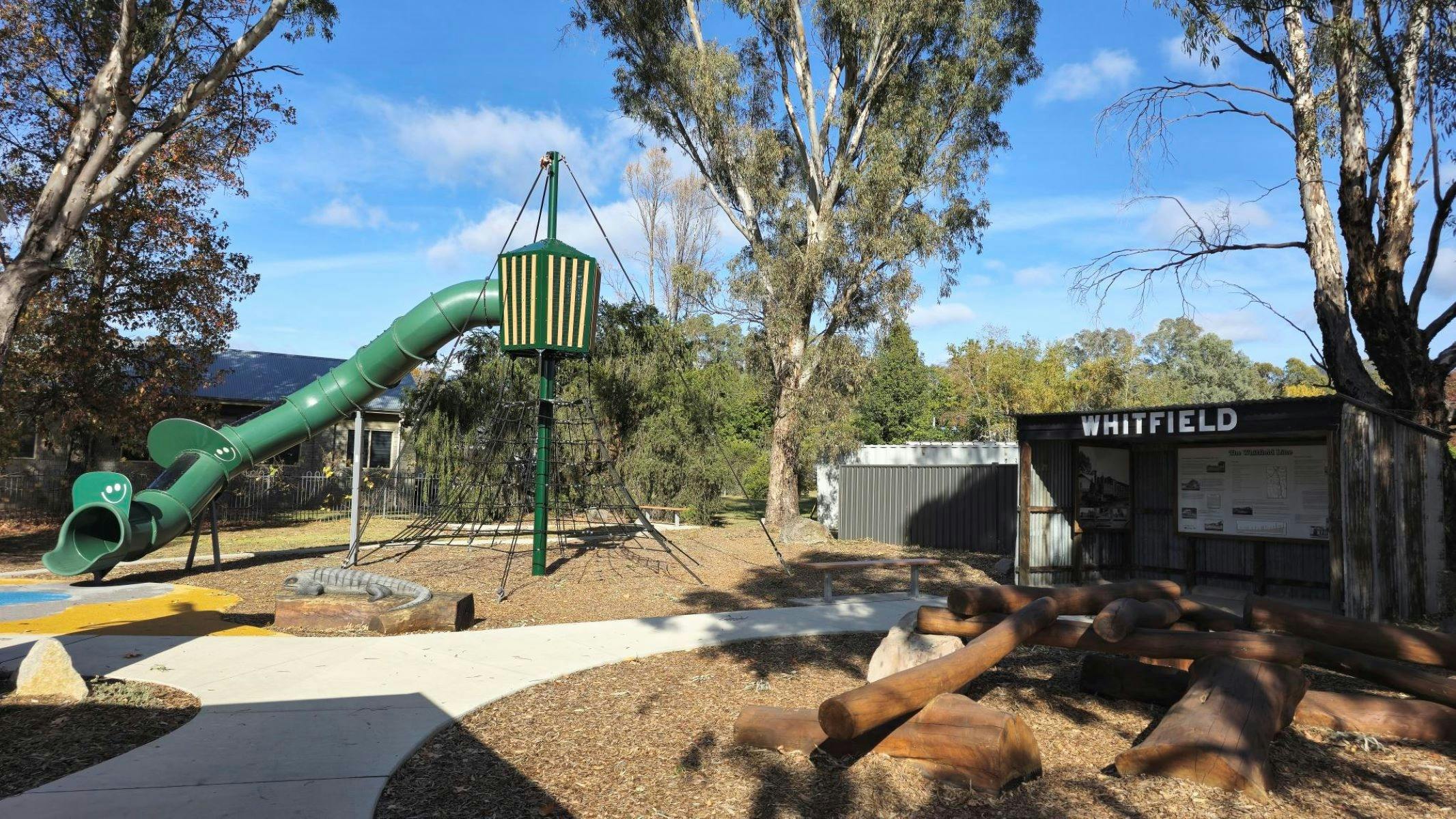 Slide and climbing net at  Whitfield Adventure Playground & Bicycle Hub