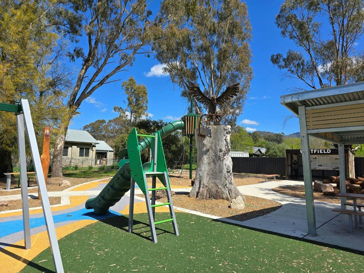 Whitfield Playground junior slide and eagle sculpture
