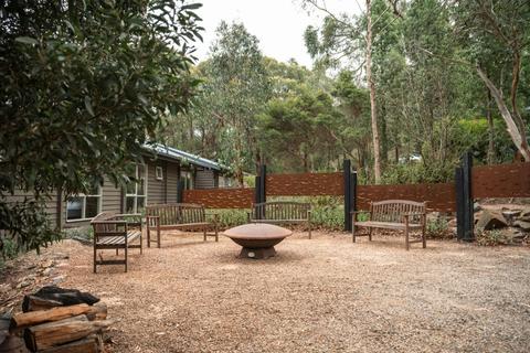 Outdoor fire pit area with bench seating for group gatherings