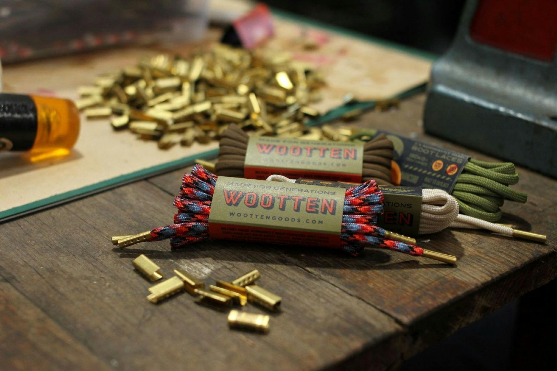 Shoelace production at Wootten. Solid brass aglets set on lengths of paracord.