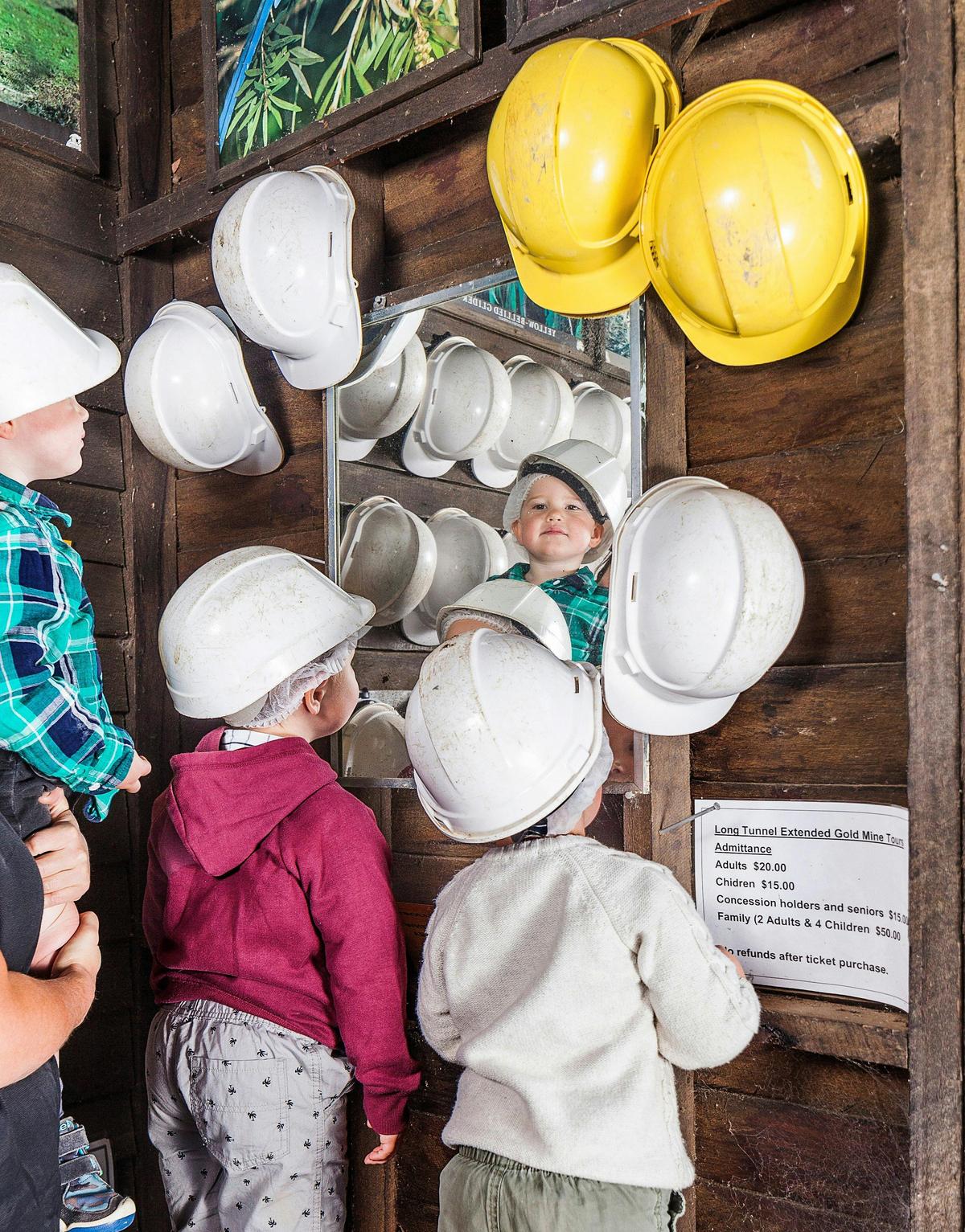 Kids choosing their helmets before a tour.
