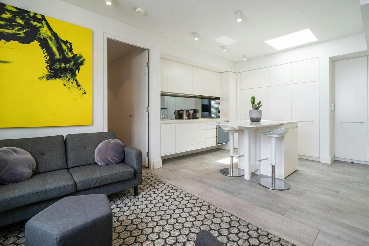 Bright and spacious living area with a modern kitchen and relaxed seating.