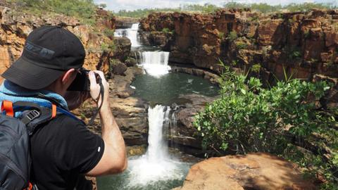 View scenic waterfalls along the Kimberley Explorer Walking Adventure