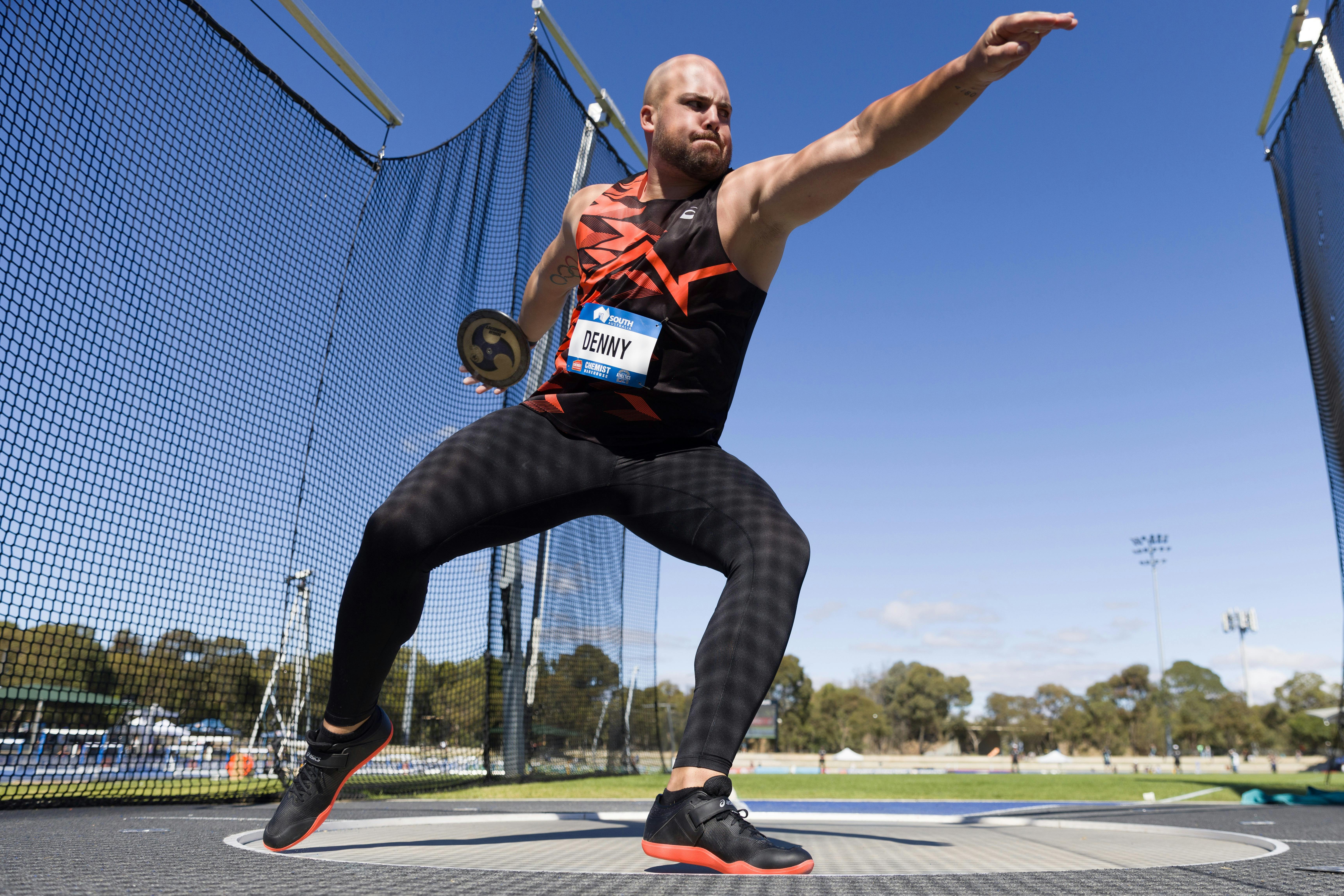 Matthew Denny mid-throw in the Discus event