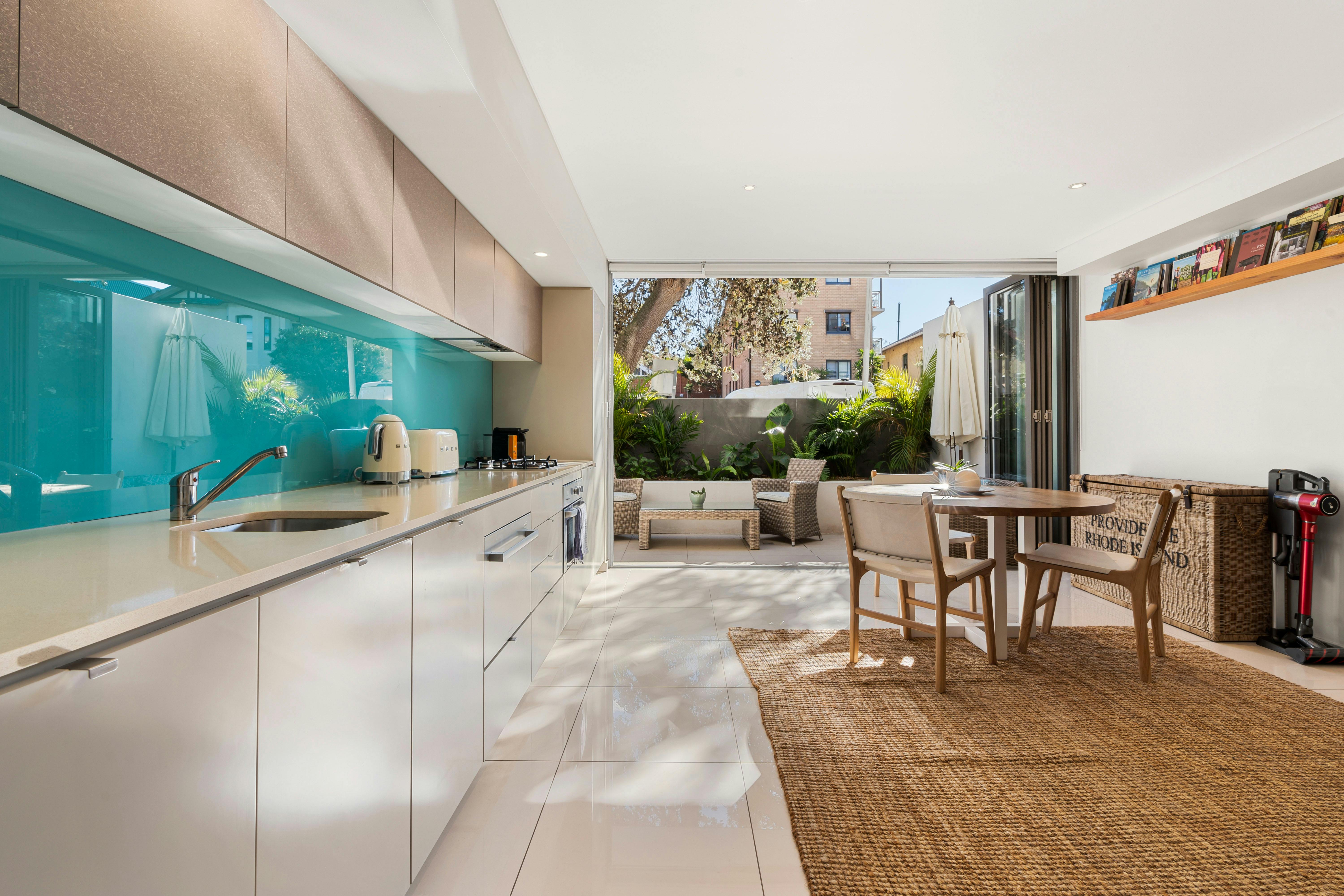Bright and airy open-plan kitchen and living area, with a stylish private courtyard.