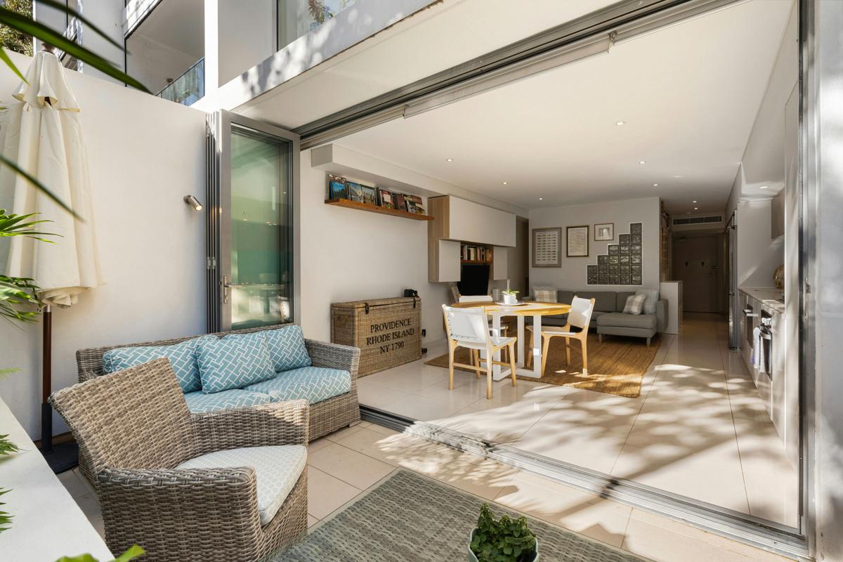 Bright and airy open-plan kitchen and living area, with a stylish private courtyard.