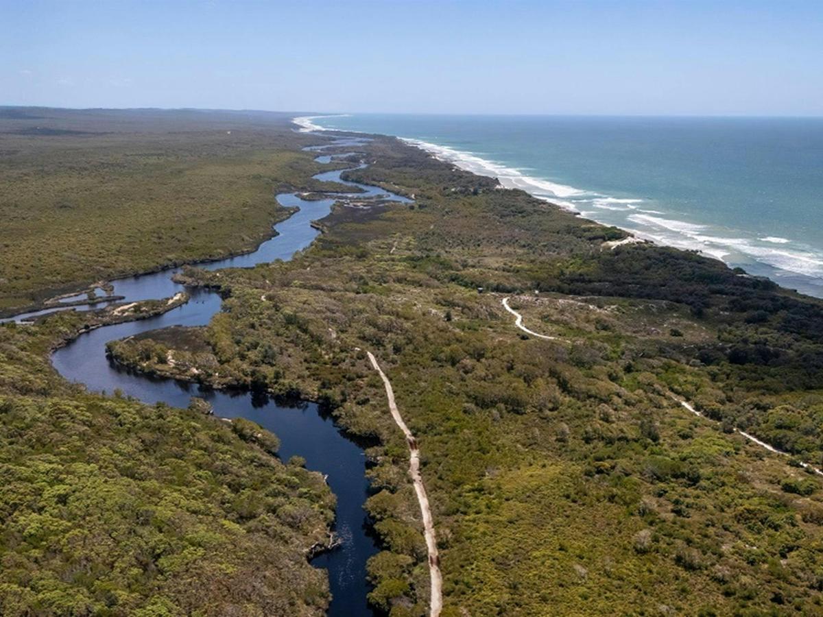 Aerial view of Jerusalem Creek, the lush green country surrounding it with walking tracks running
