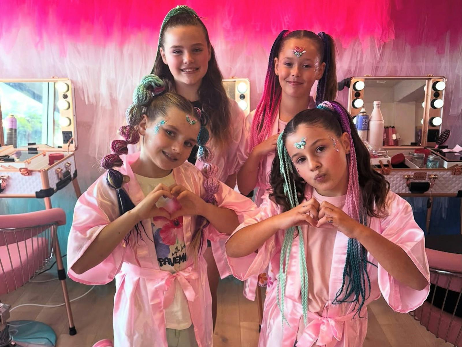 Four girls dressed up in pink and colourful manes by Manemerised