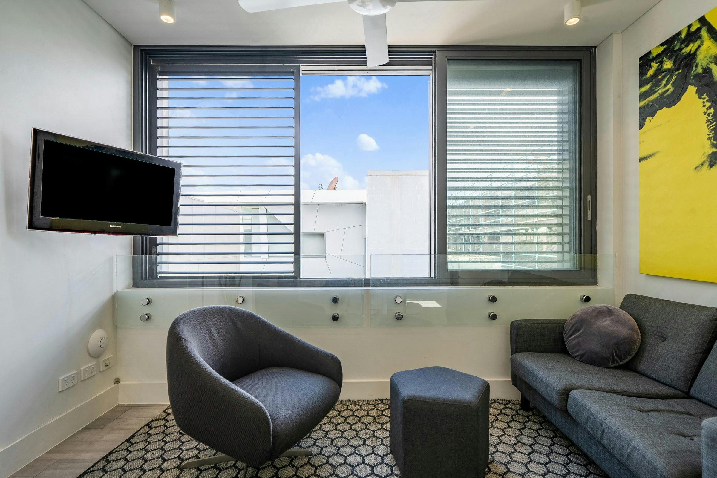 Bright and spacious living area with a modern kitchen and relaxed seating.