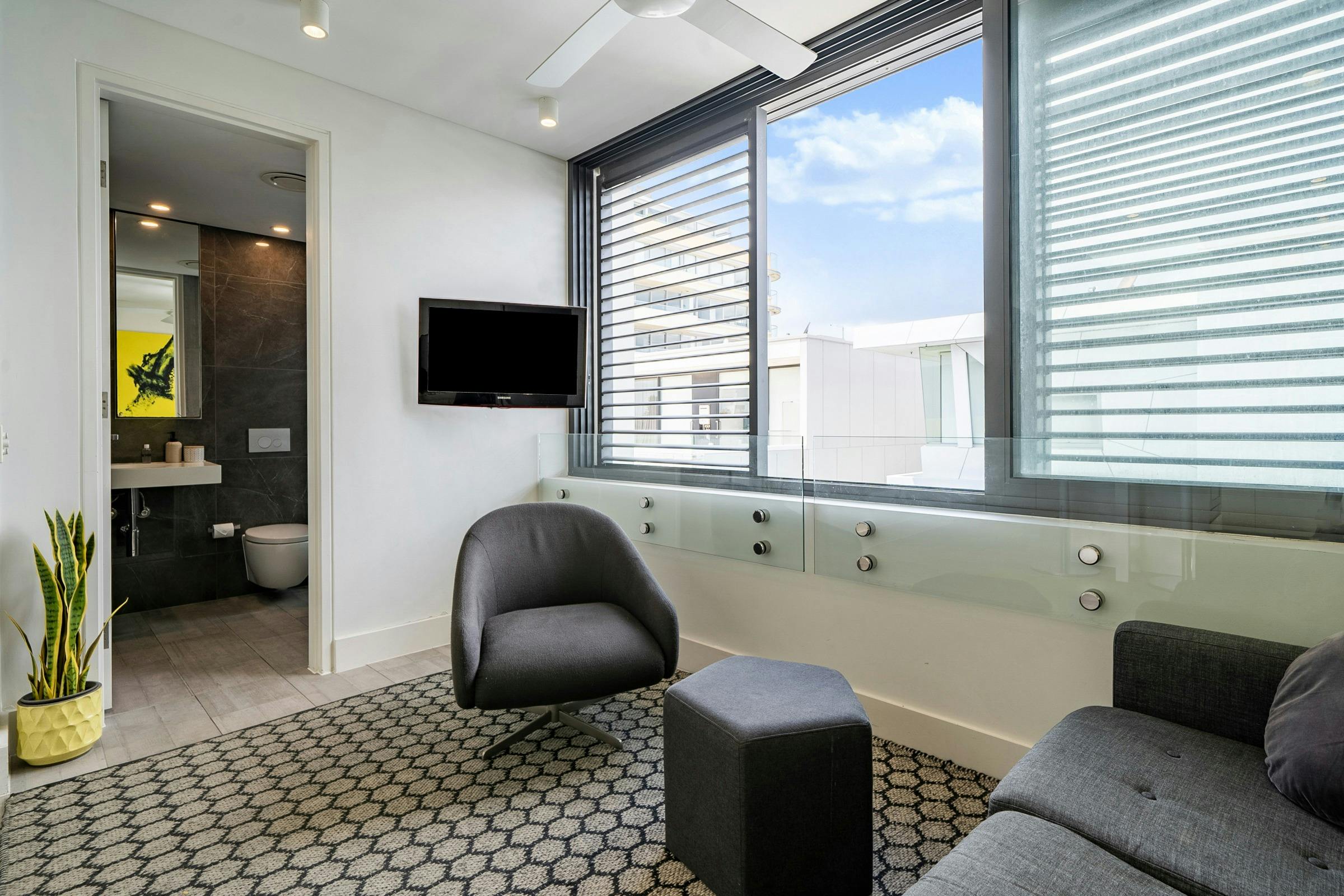 Bright and spacious living area with a modern kitchen and relaxed seating.