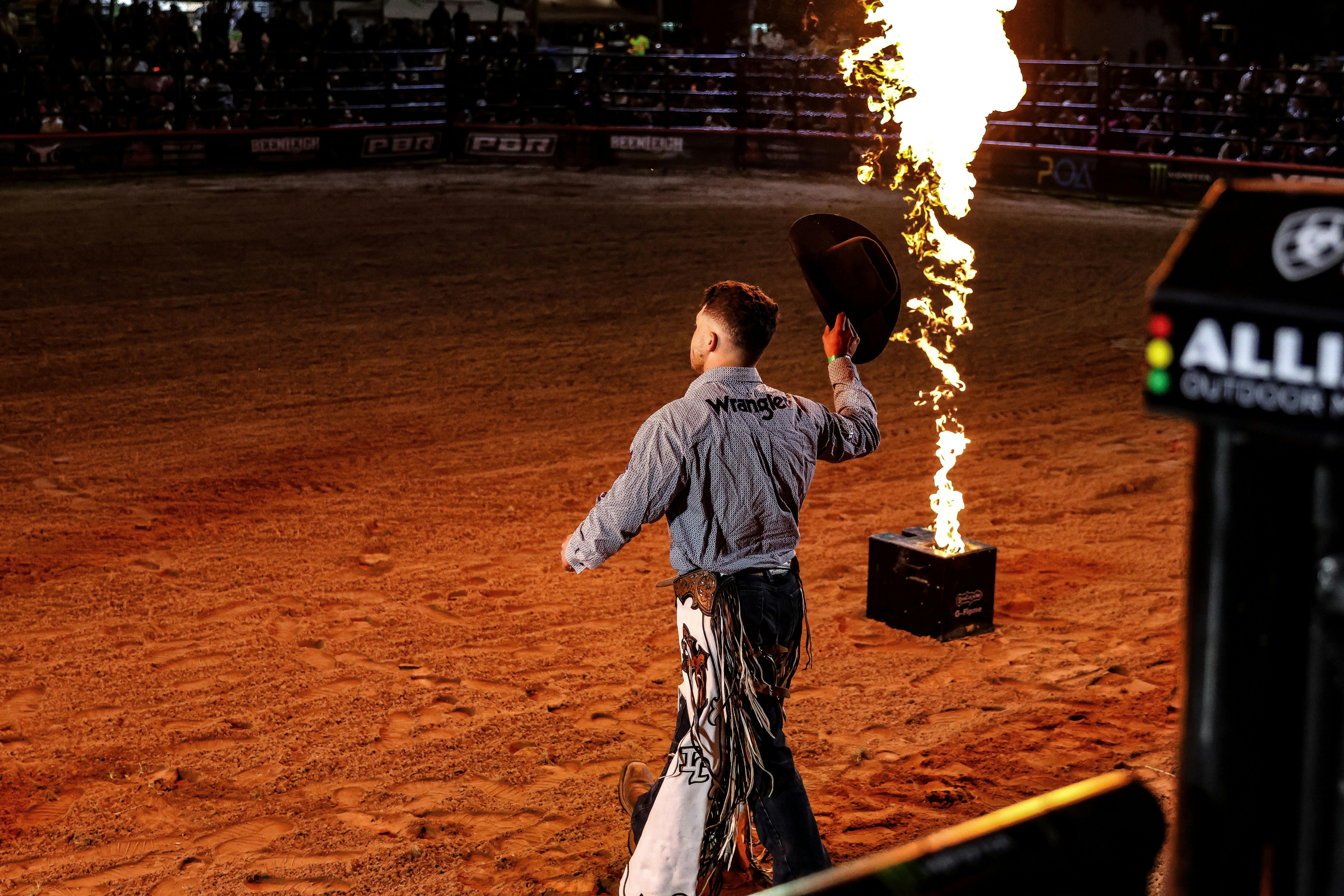 PBR cowboy enters arena.