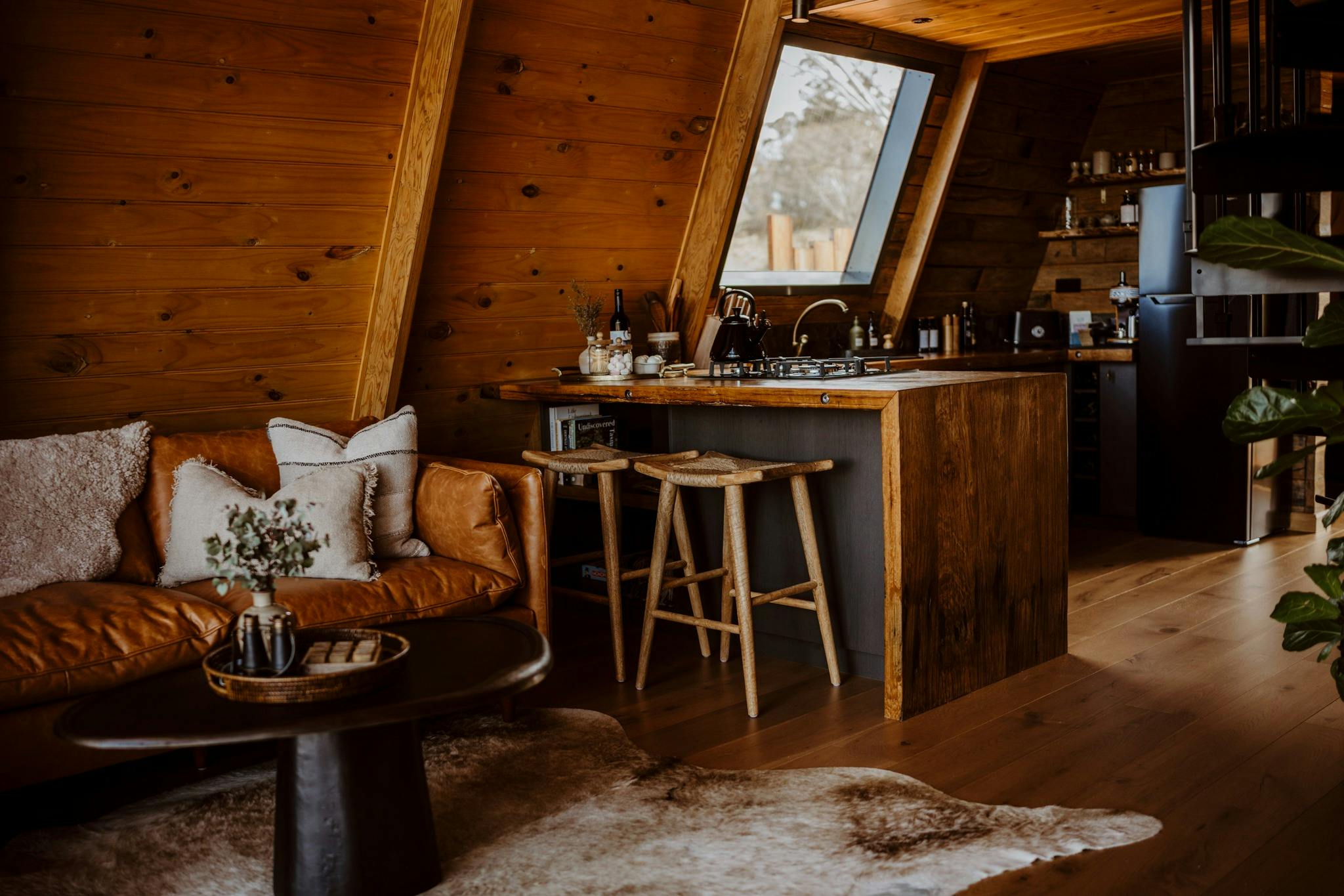 open-plan interior with a fully equipped kitchen and comfortable living area