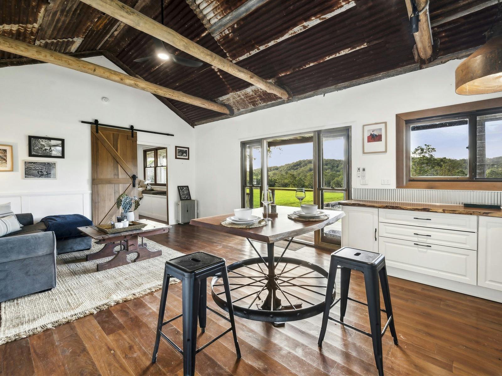 Open-plan living and kitchen at The Hitching Rail Hut, Coramba NSW near Coffs Harbour