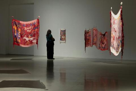 Visitor looking at Linda Sok's exhibition at Campbelltown Arts Centre