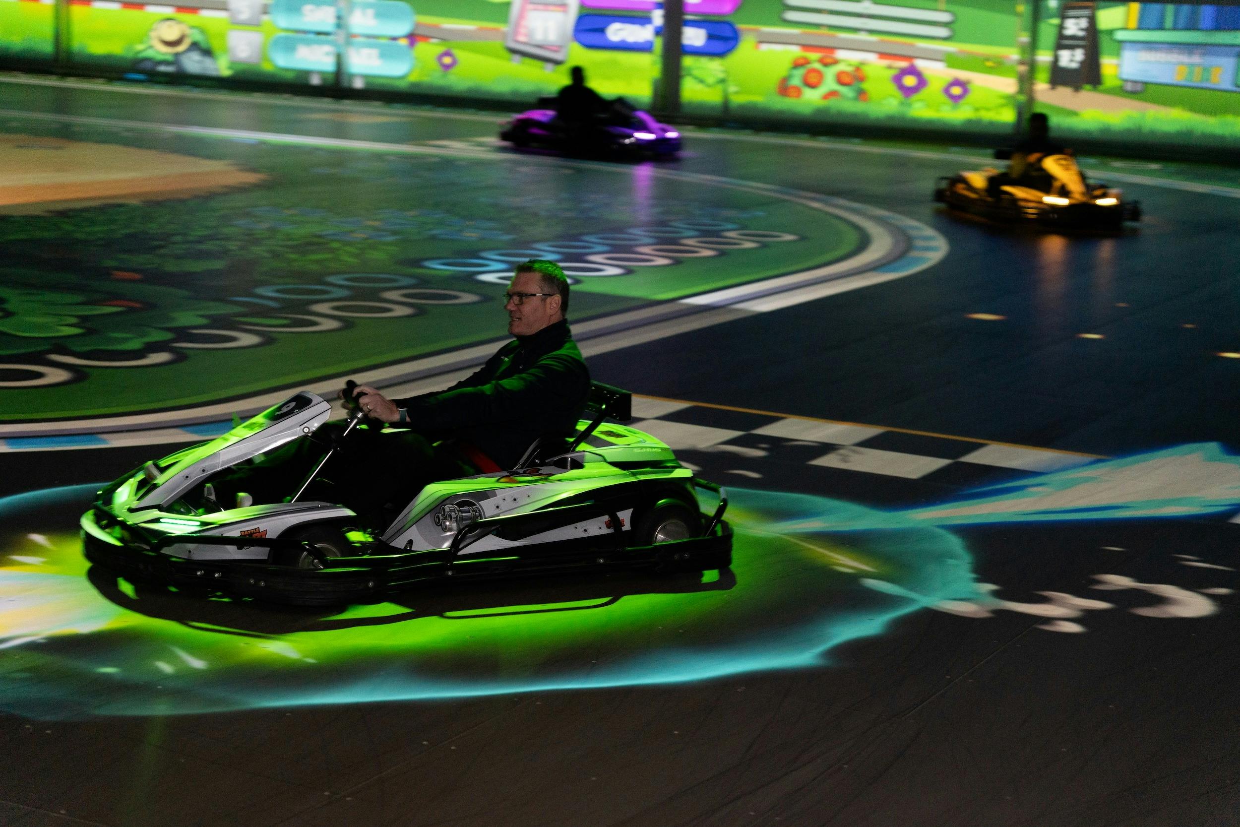 A driver with a boost activated during BattleRace