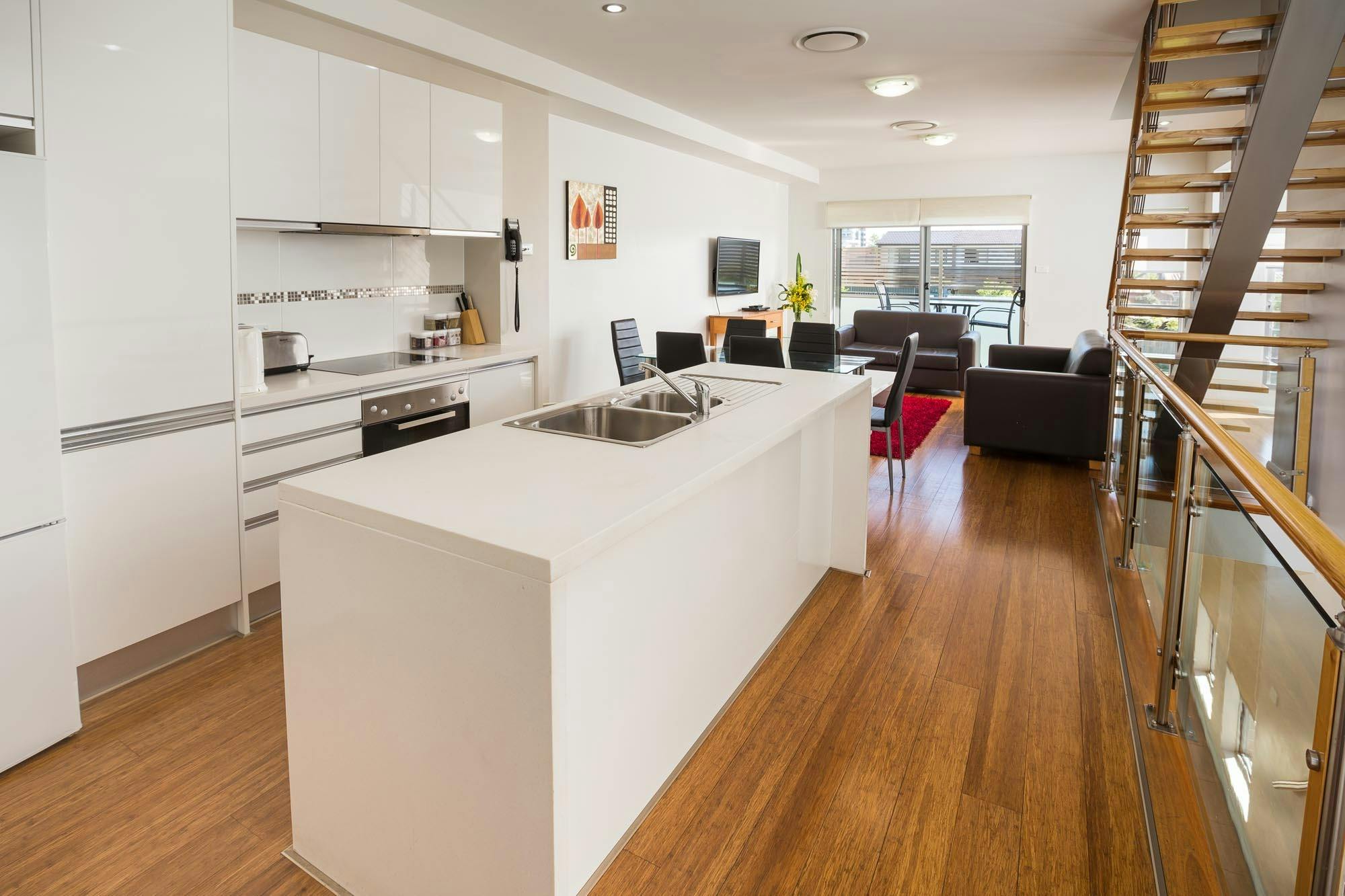 Two Bedroom apartments feature fully equipped kitchens and separate living areas.