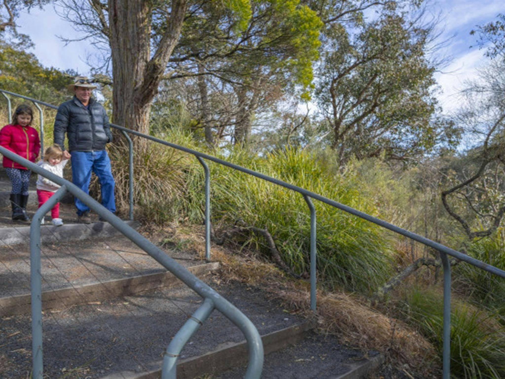 Family walking down stairs Apsley Falls picnic area Oxley Wild Rivers National Park. Photo: John
