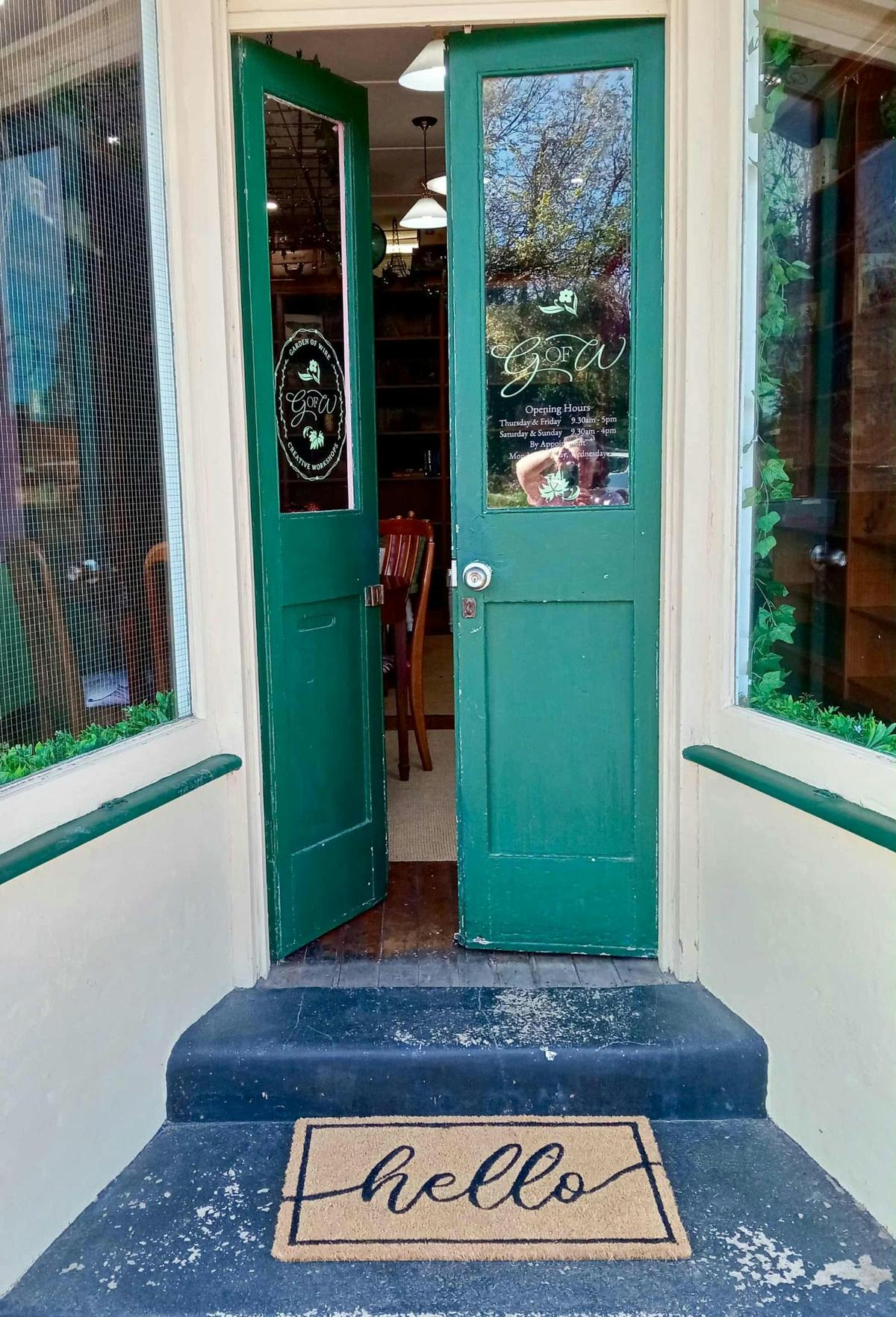 Front doors of the Garden of Wire and our hello mat to welcome guests