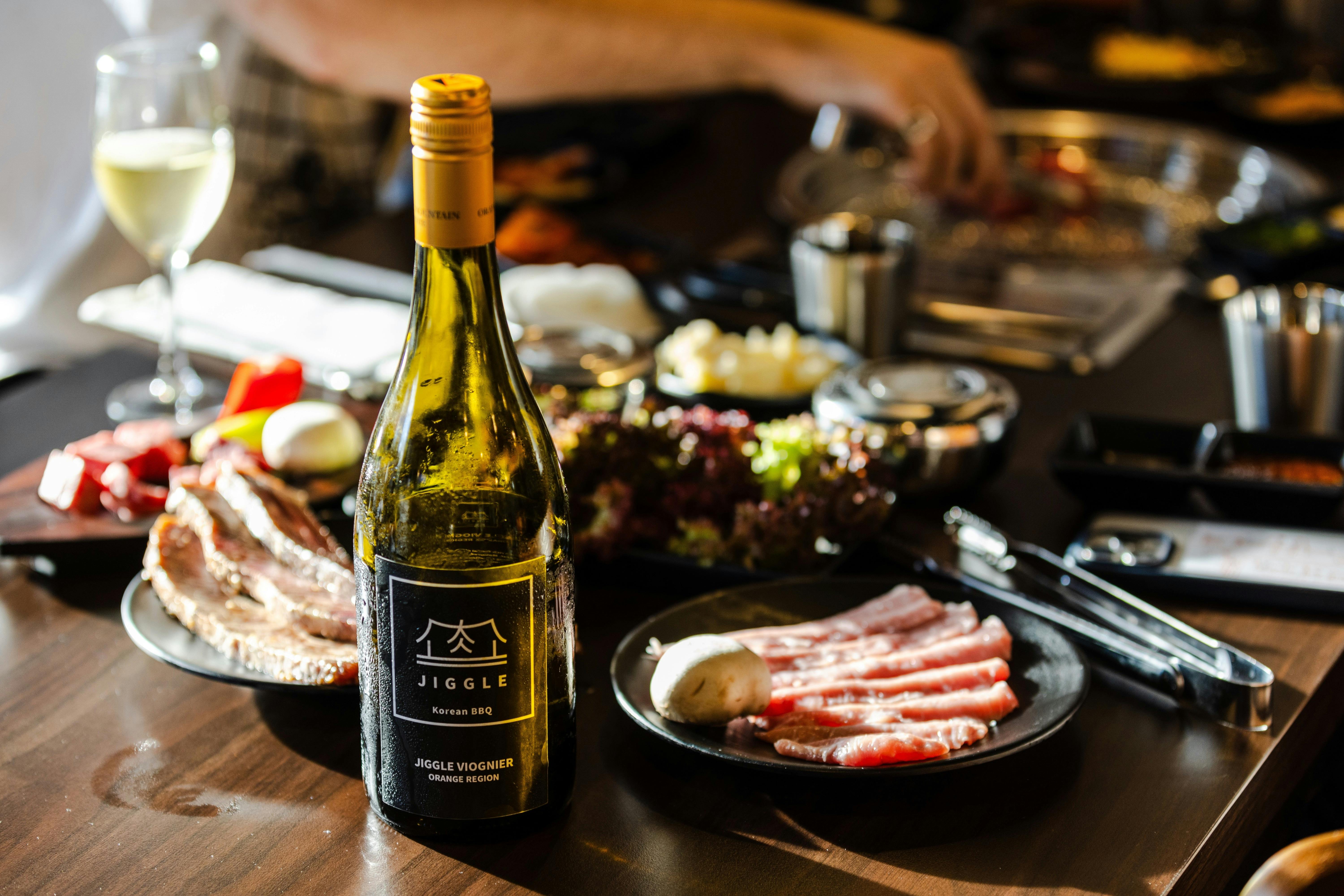 Enjoying jiggle wine from Orange, NSW with Australian wagyu beef and pork.