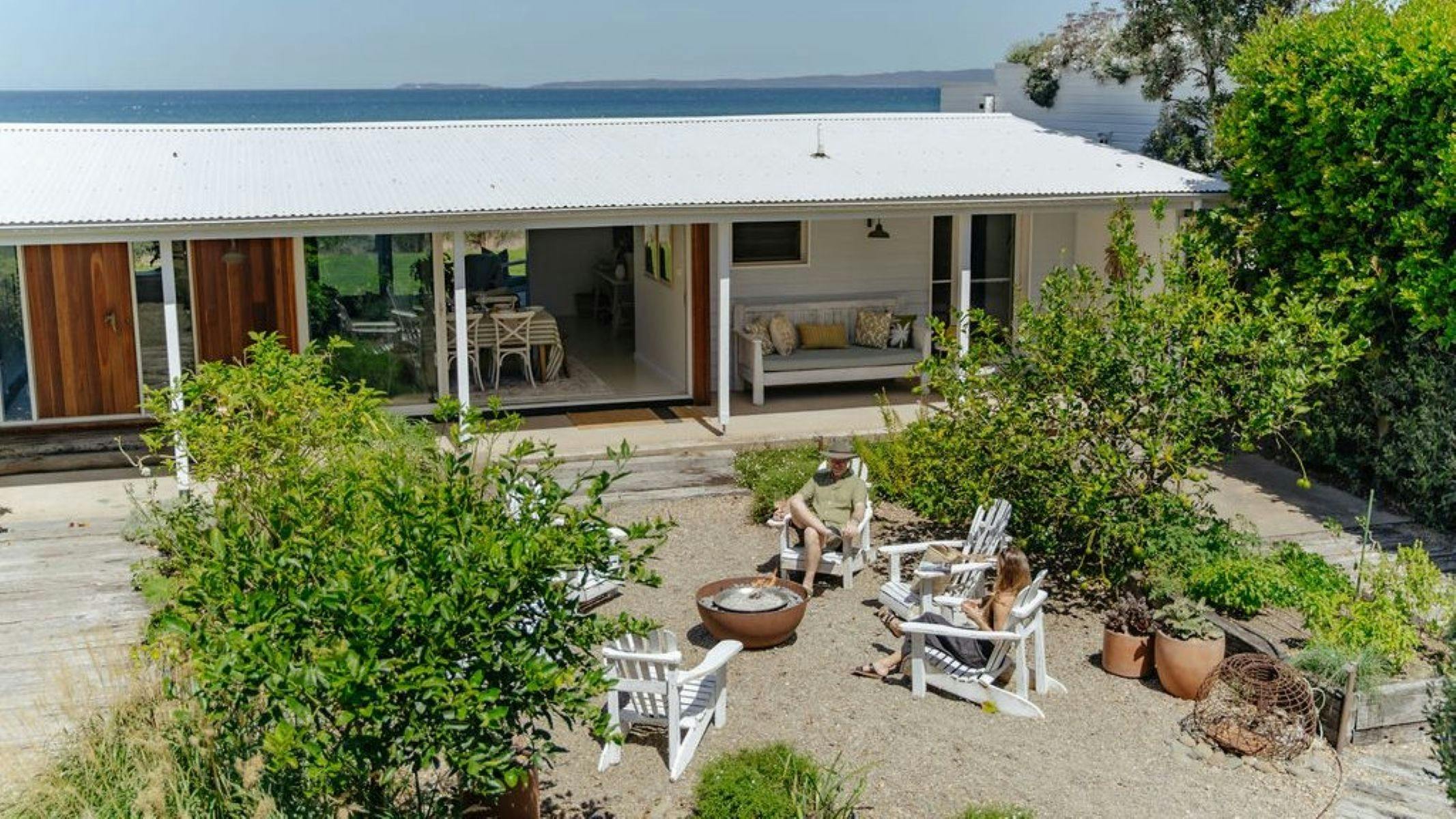 Slowly it reveals itself, opening toward a tranquil courtyard with a firepit for family to enjoy