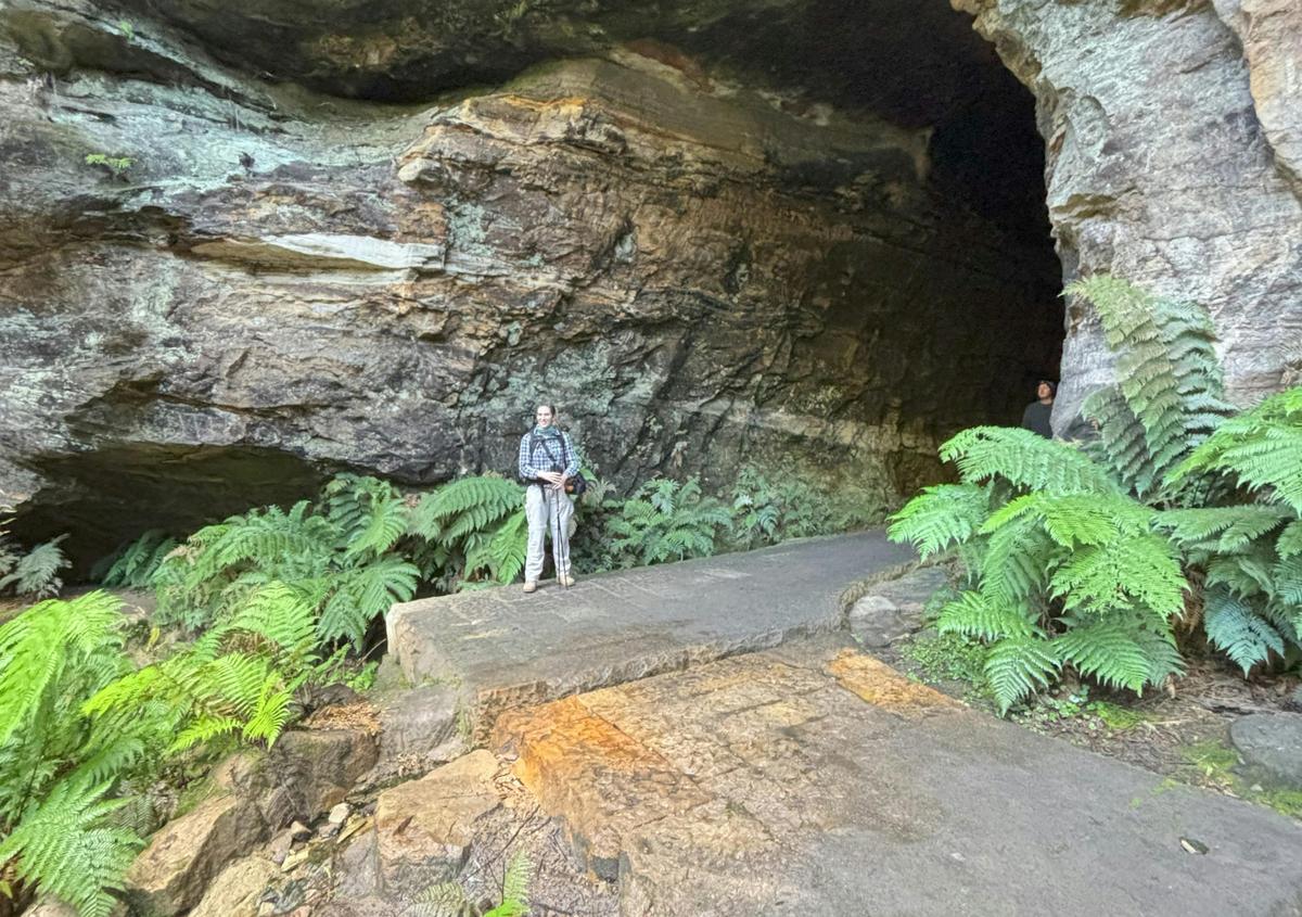 Heritage Hikes Australia archaeologist and guide at the entrance to the Glow Worm Tu