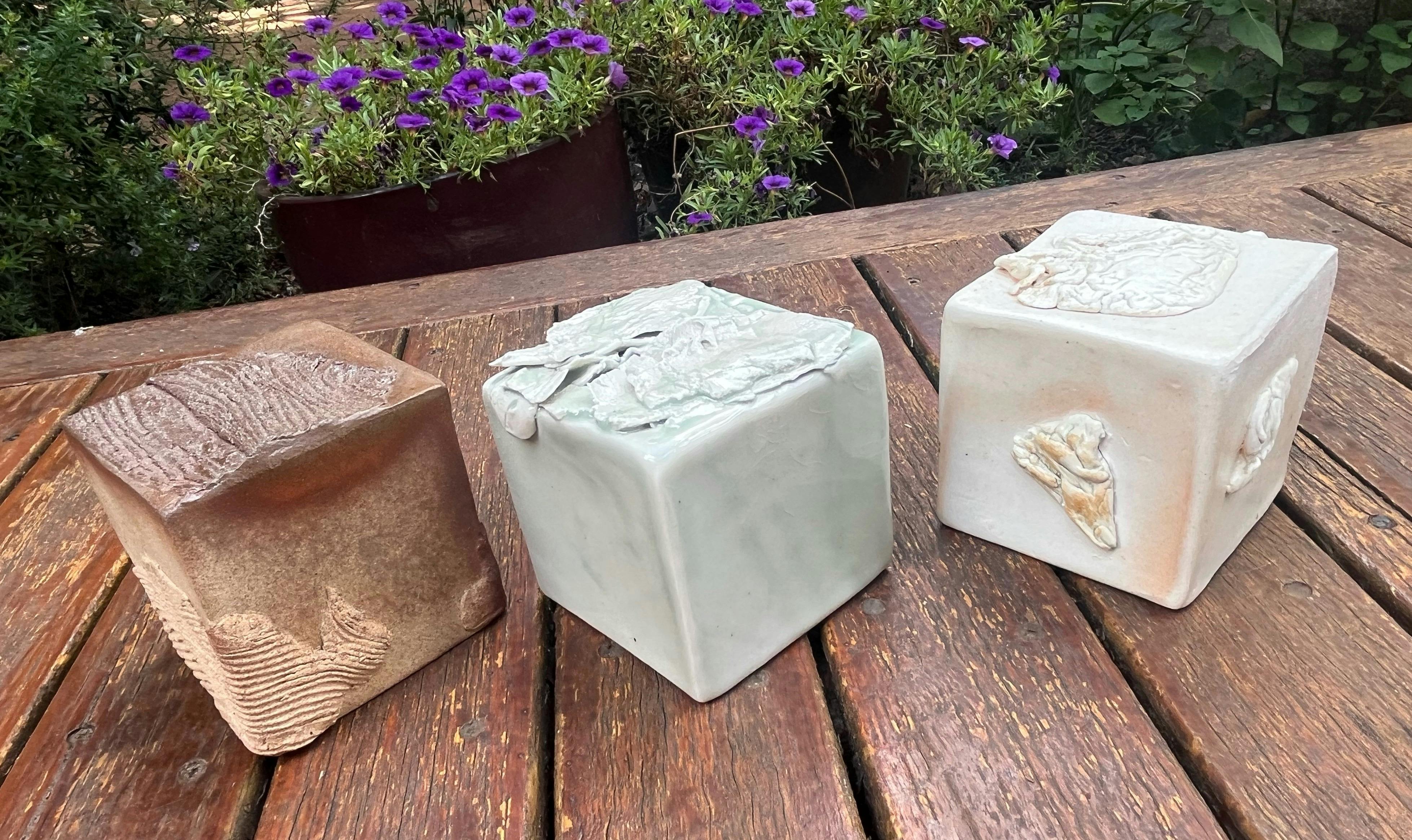 Cubes, a tactile, textured dialogue between flame and form, by Trevor Heldt