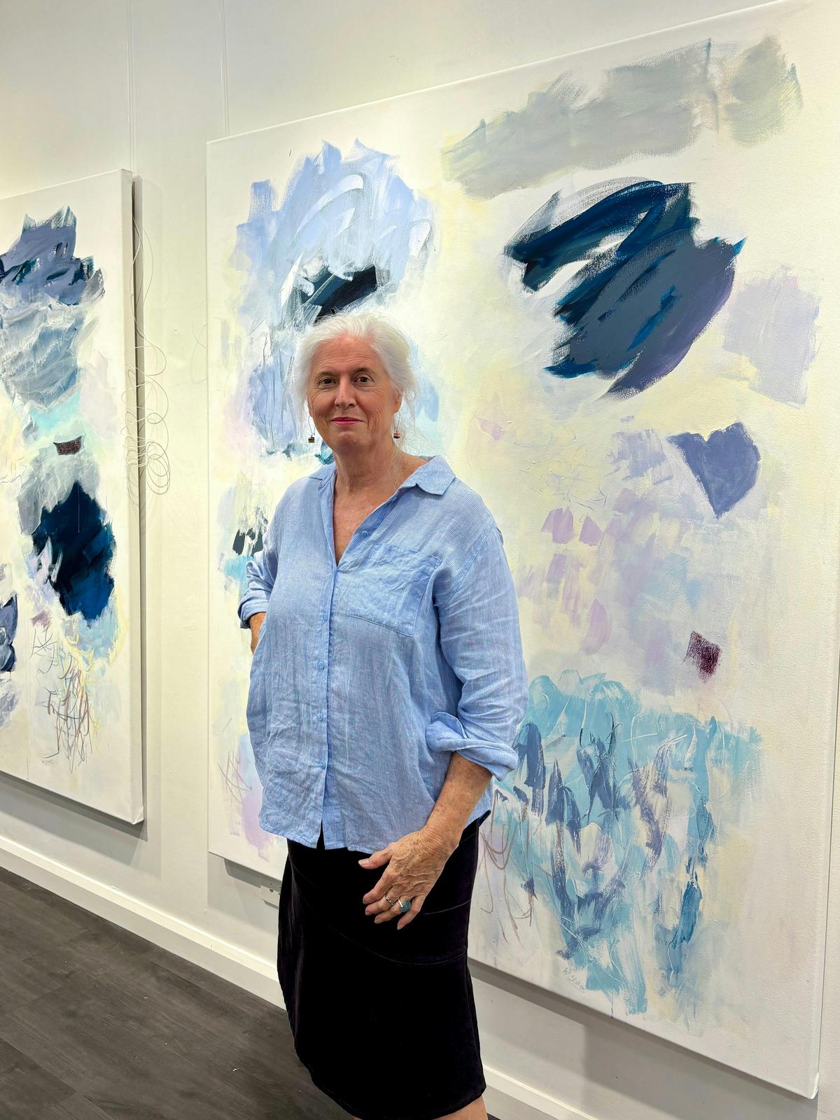 Wendy Stokes with her artworks at Luminance Gallery Port Macquarie