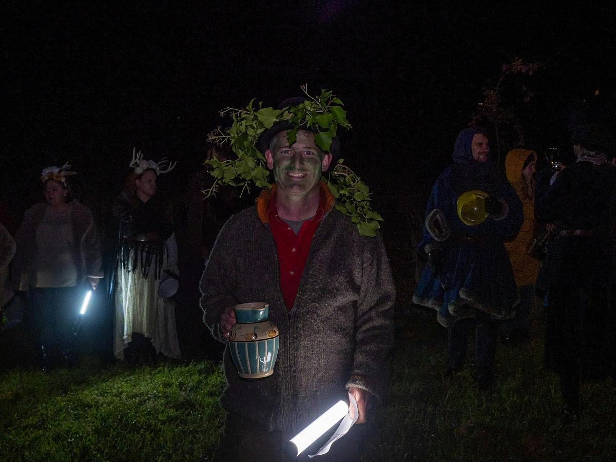 We venture into the orchard to bless the trees with cider.