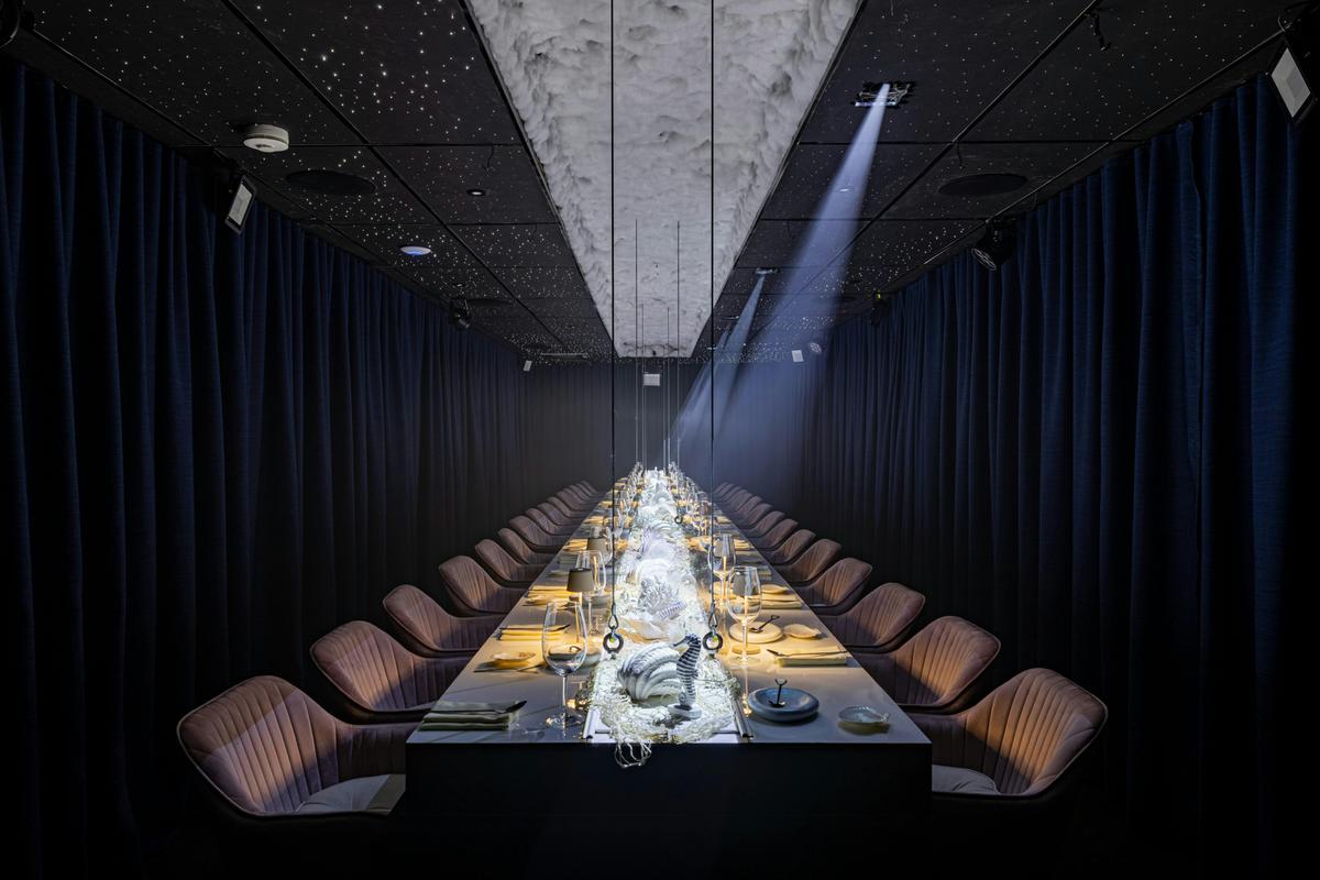 A dining setting with mood lighting and table centres
