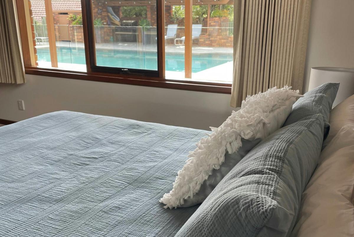 King Bed ready for slow mornings and take in pool views and happenings without getting out of bed